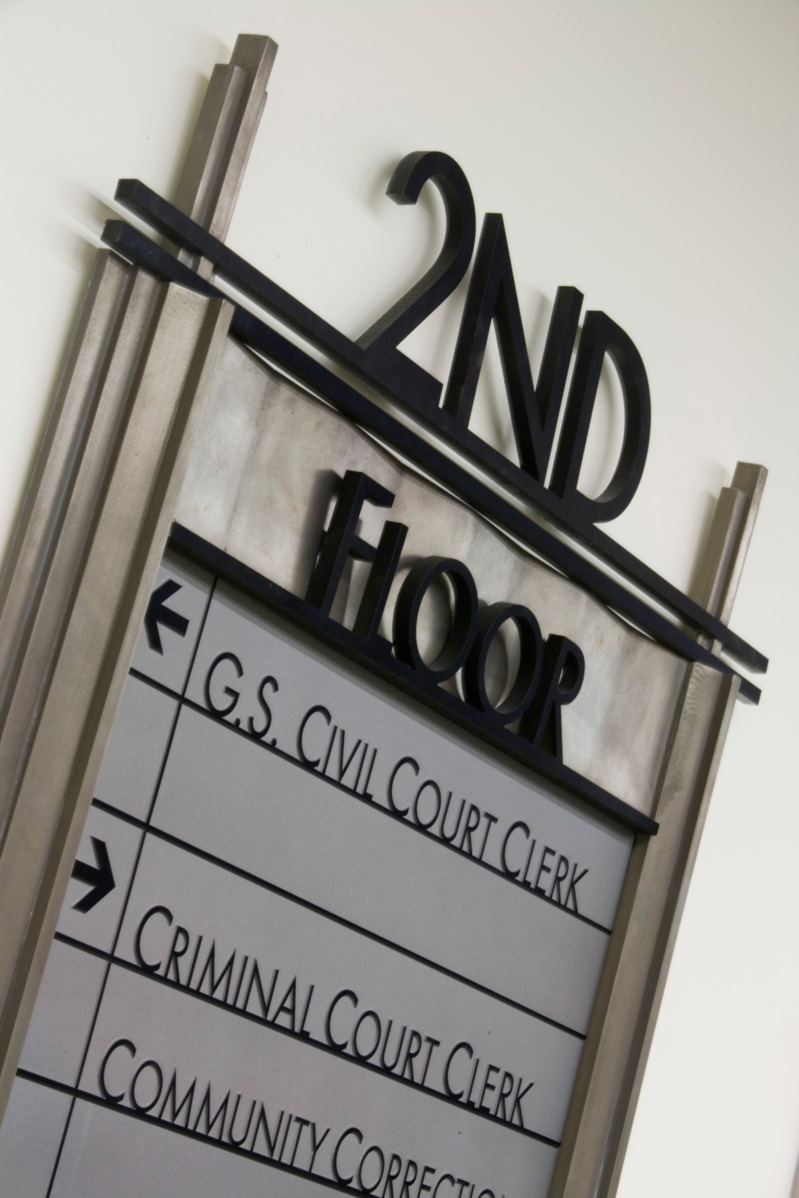 a sign on a wall in a courthouse