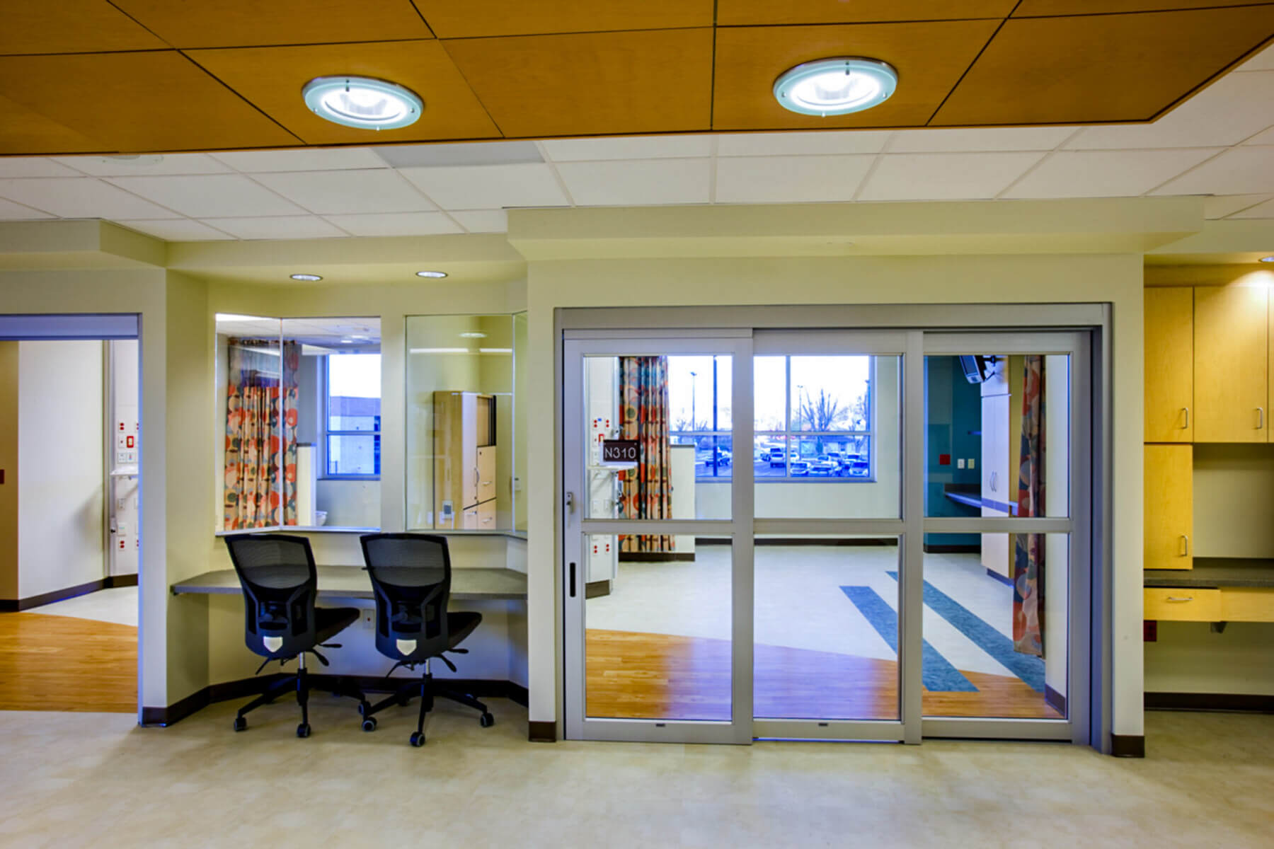 nurse desk and chairs for charting outside patient rooms