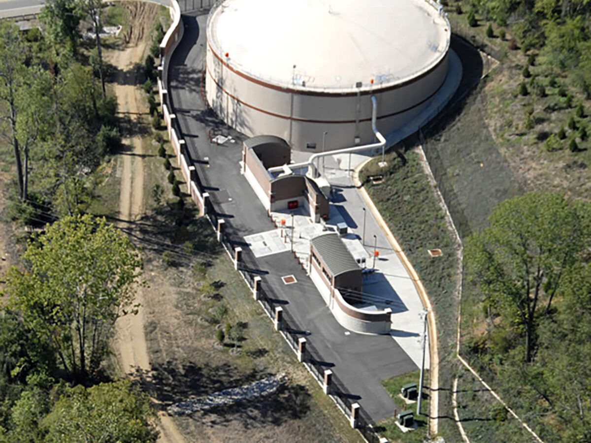 Aerial view of circular, pre-stressed concrete equalization basin at Fourth Creek/Walker Springs Pump Station.