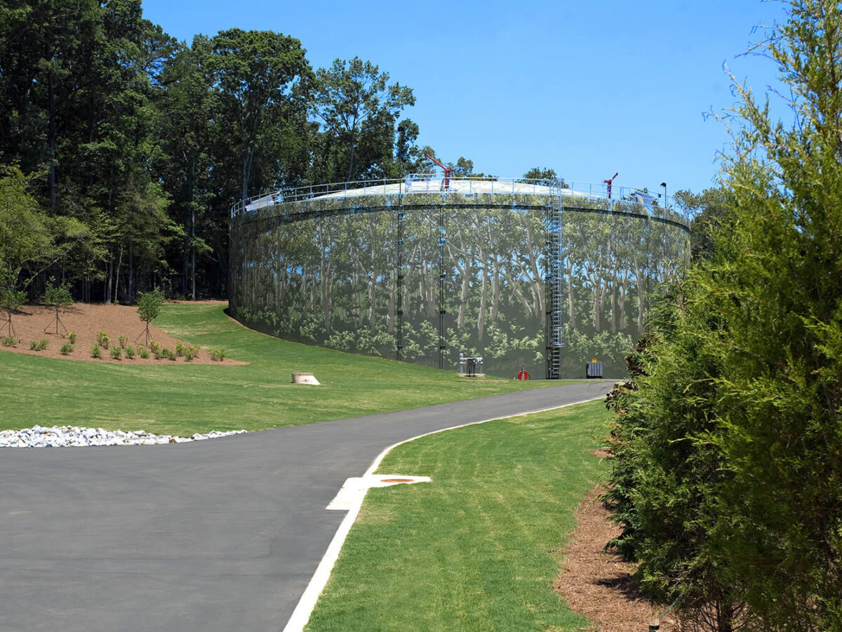 a mural on the exterior of a wastewater storage tank