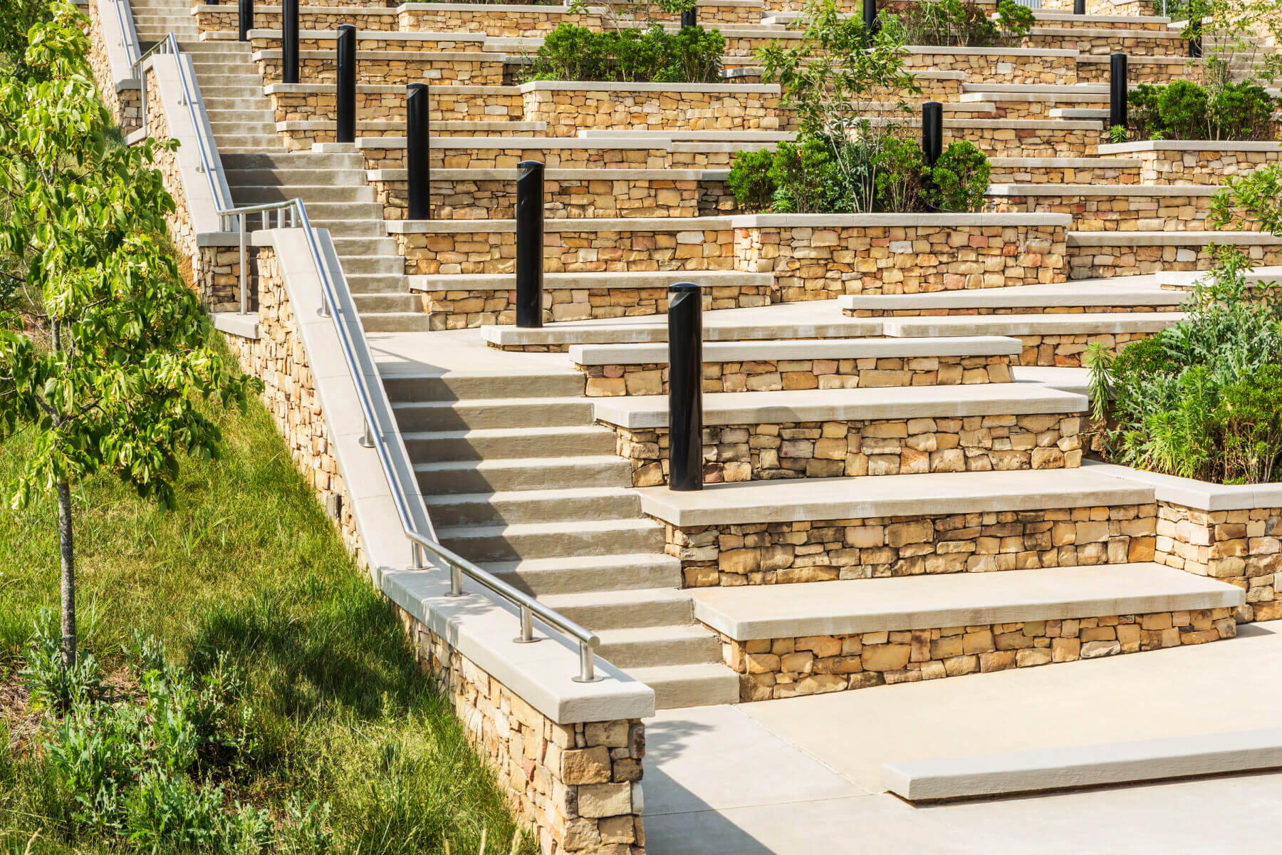 a stone stairs with metal railings