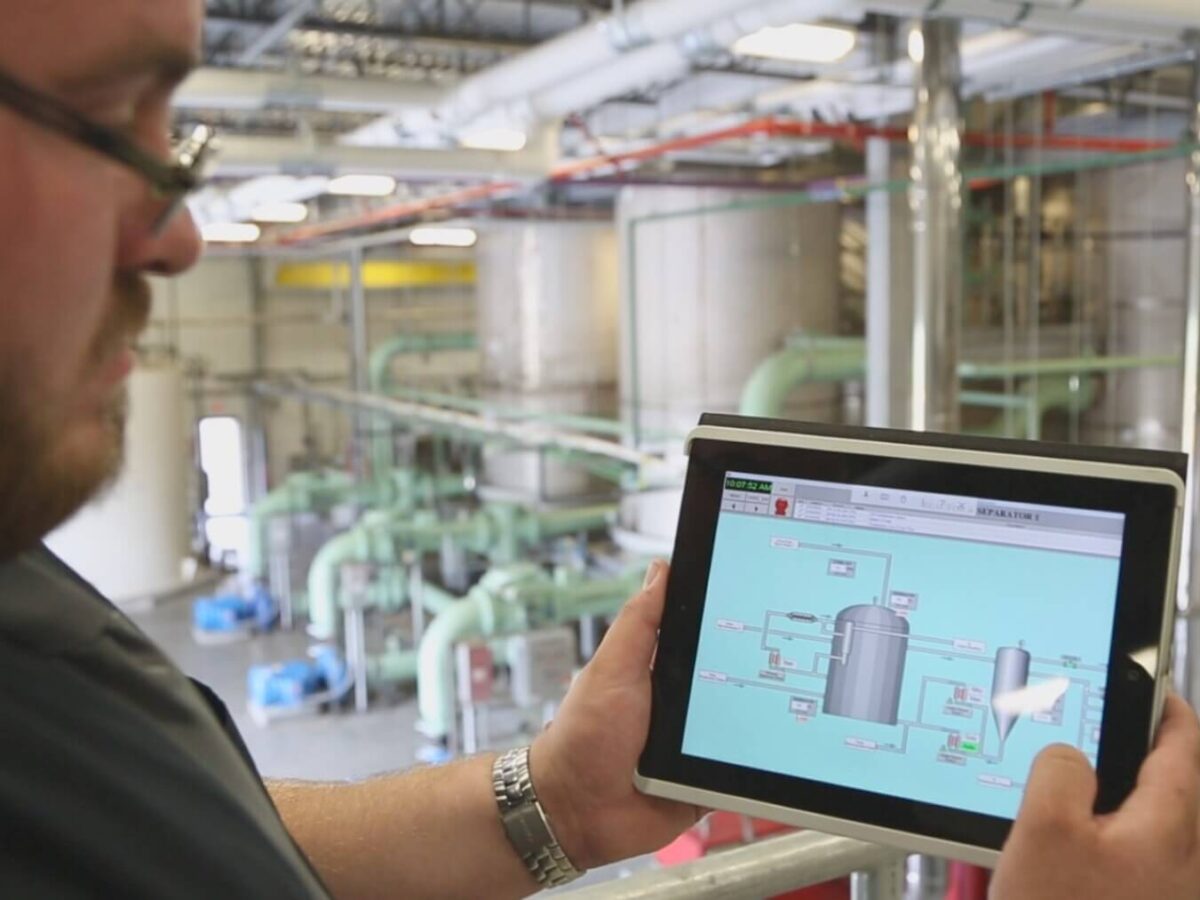 a person holding an ipad analyzing the deicing system at T.F. Green