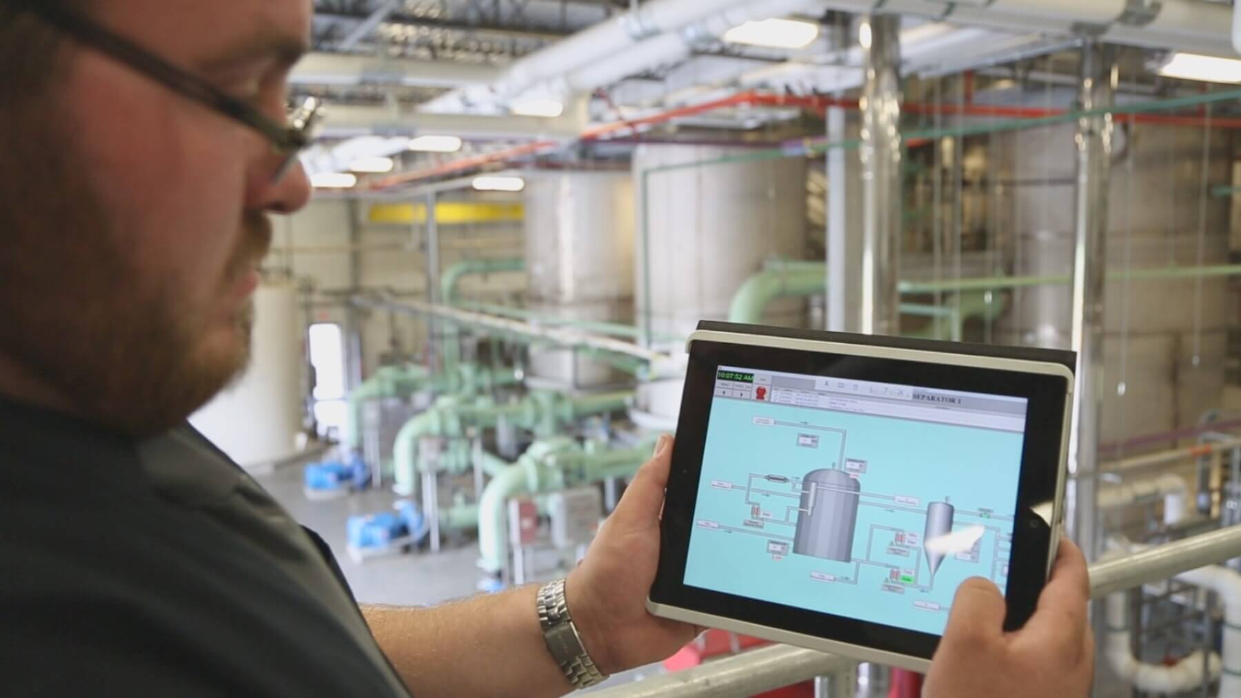 a person holding an ipad analyzing the deicing system at T.F. Green