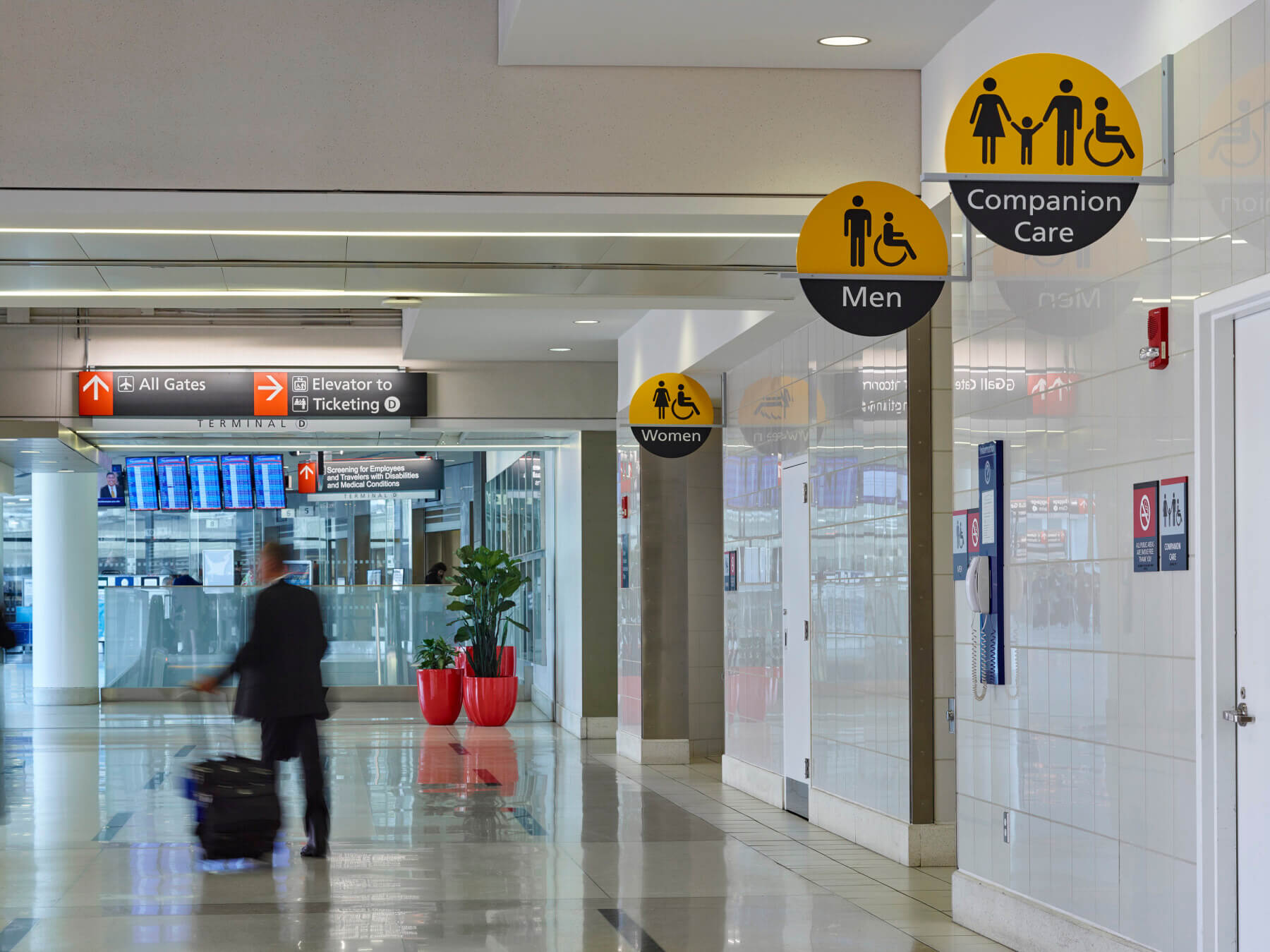 overhead signs outside of restrooms at Philadelphia International Airport