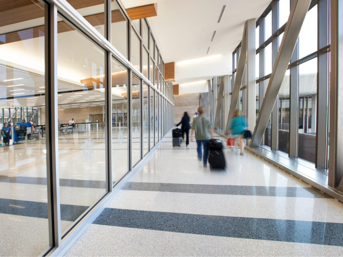 passengers walking down the corridor to security screening at Norfolk International Airport