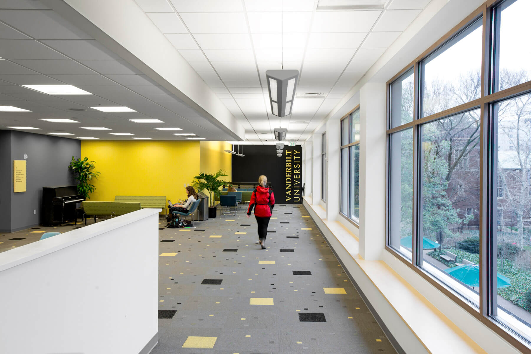 Student walking through study area in Vanderbilt University student center