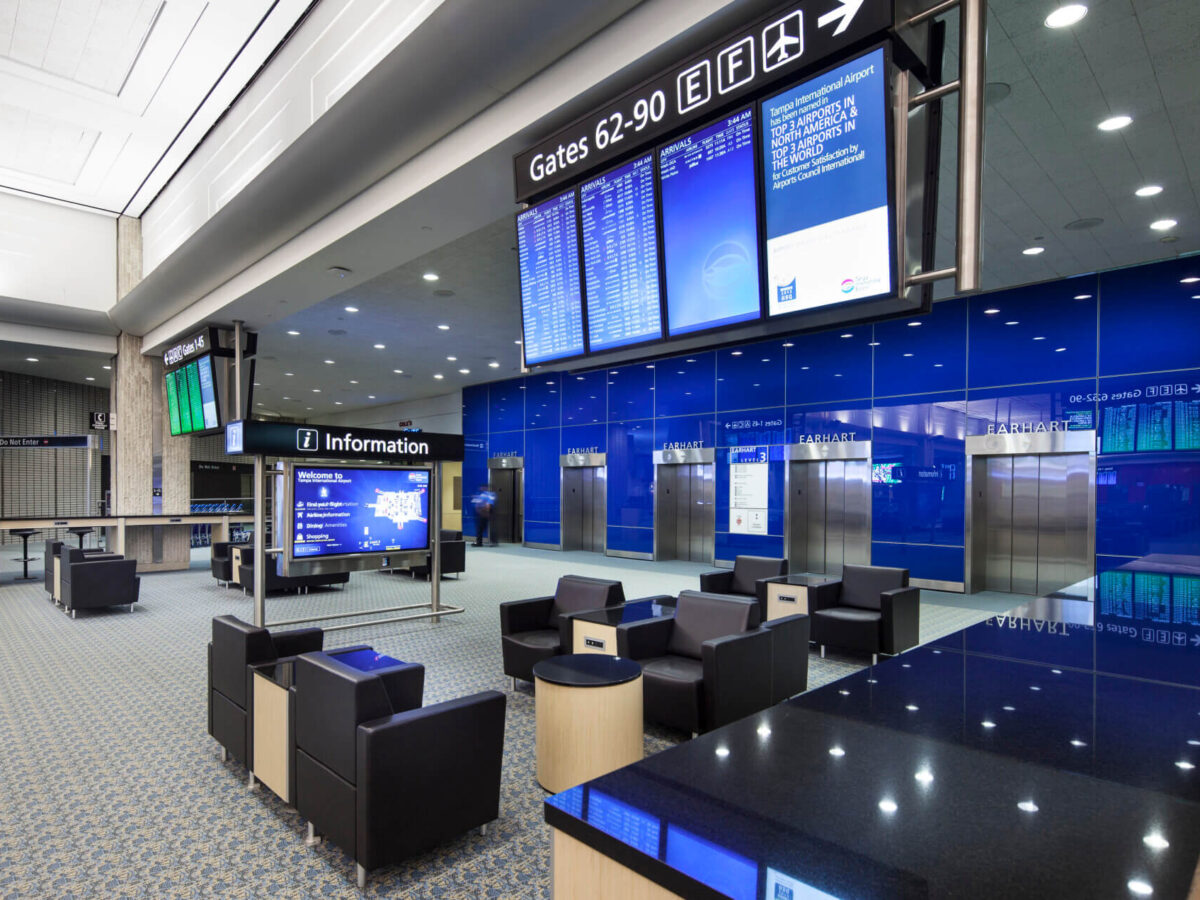 a seating area next to the elevators in the terminal at Tampa International Airport