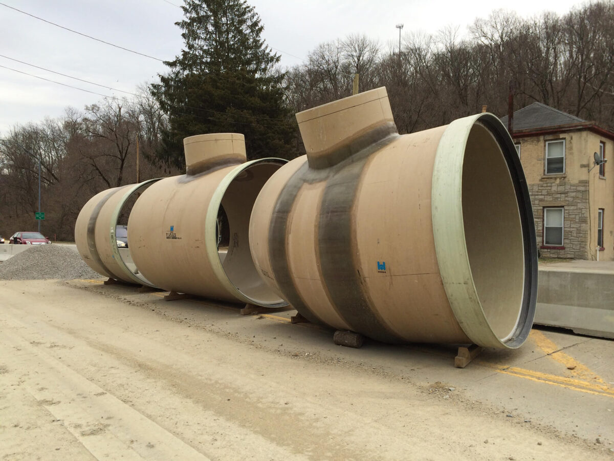 Pipes placed along the road prior to construction.