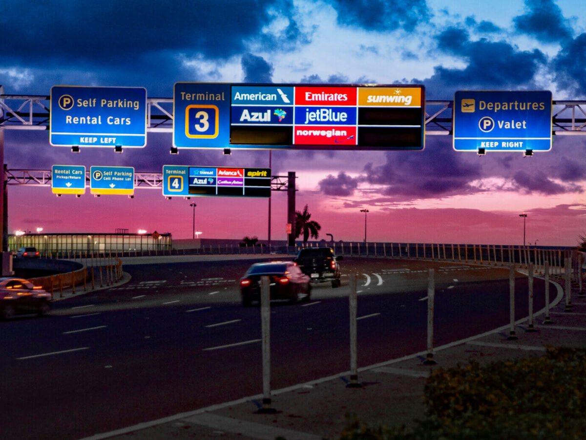 overhead directional signage on the roadway leading to Fort Lauderdale-Hollywood International Airport