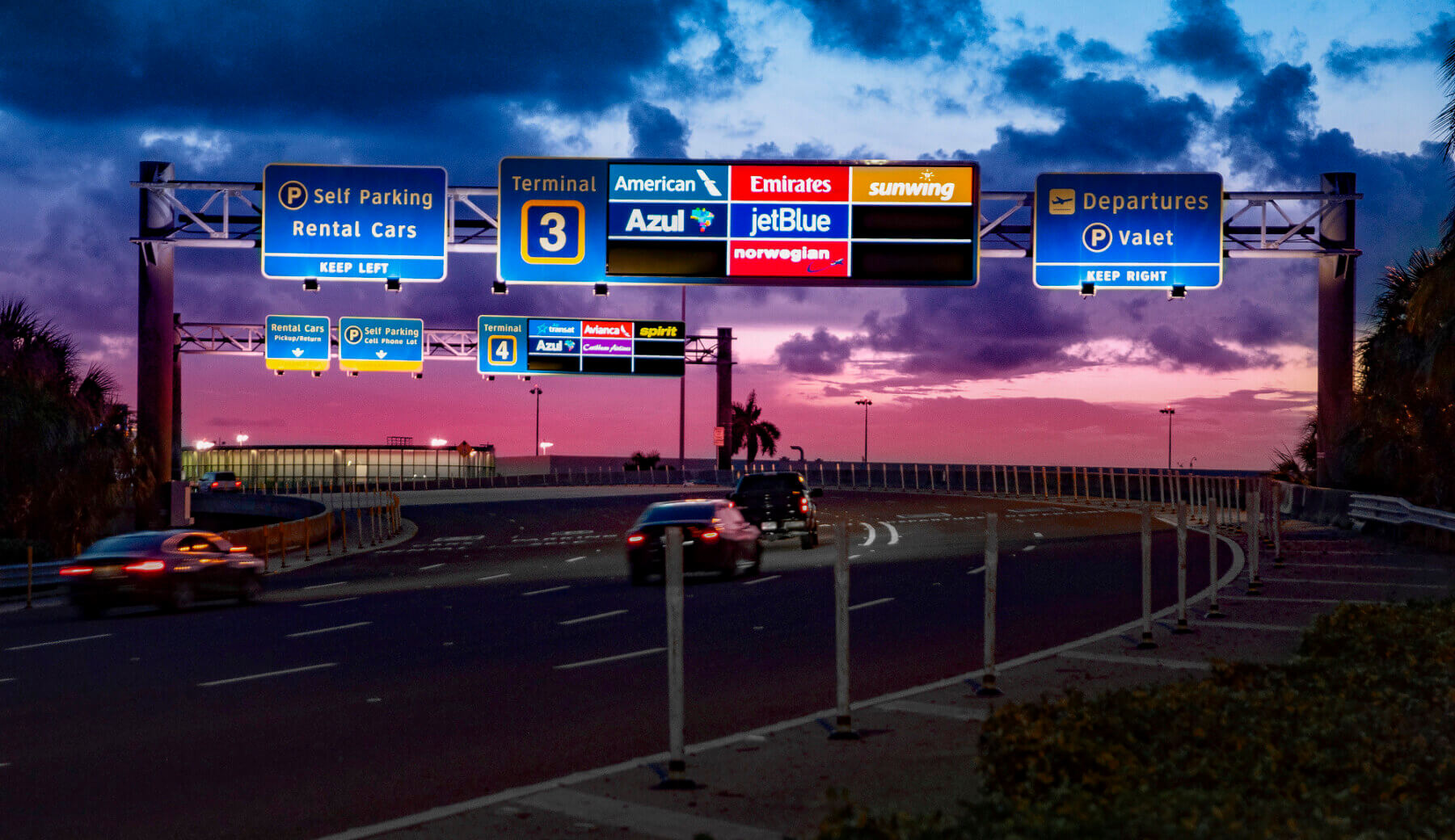 overhead directional signage on the roadway leading to Fort Lauderdale-Hollywood International Airport