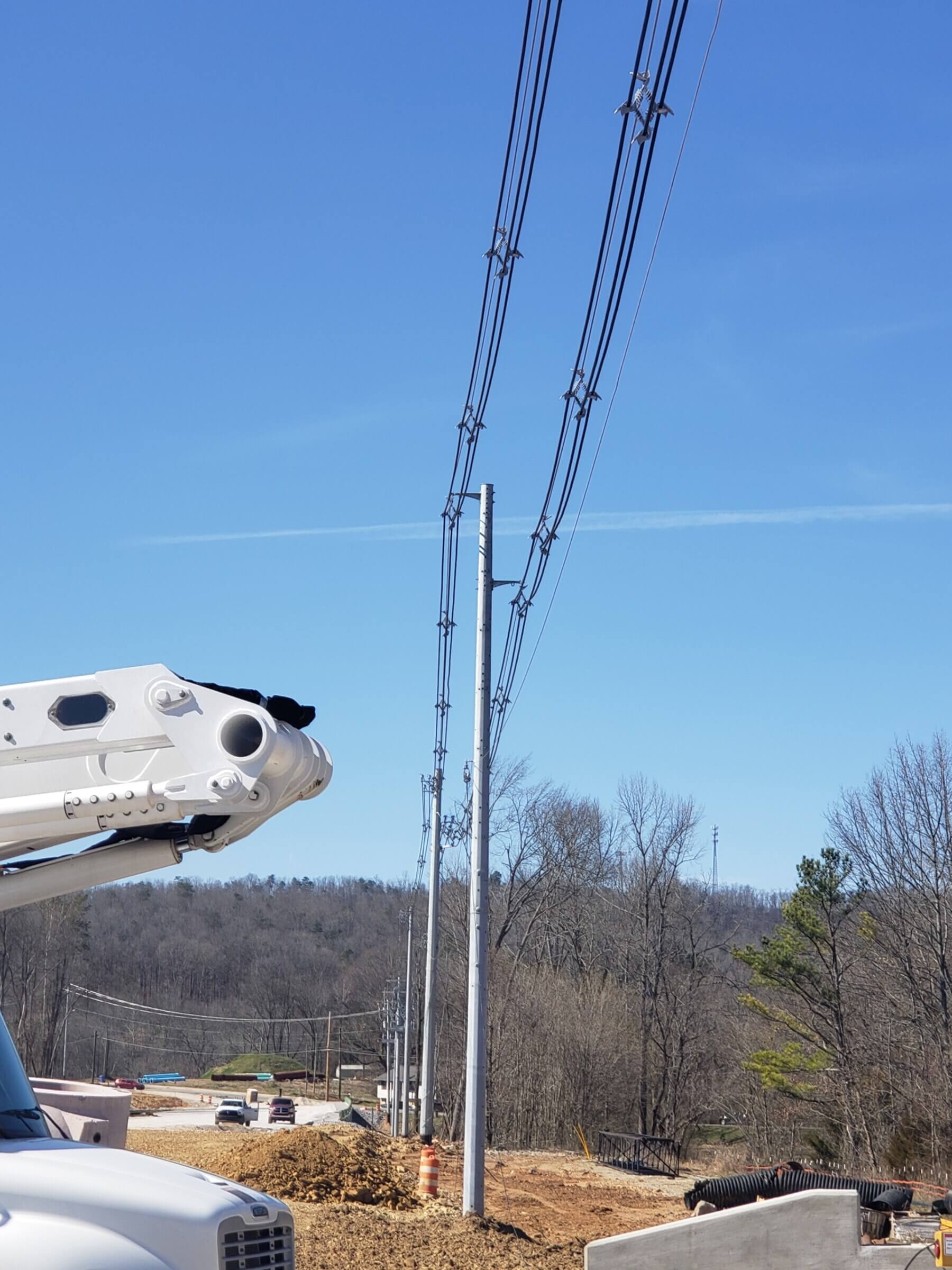 utility poles and dirt at Apison Pike