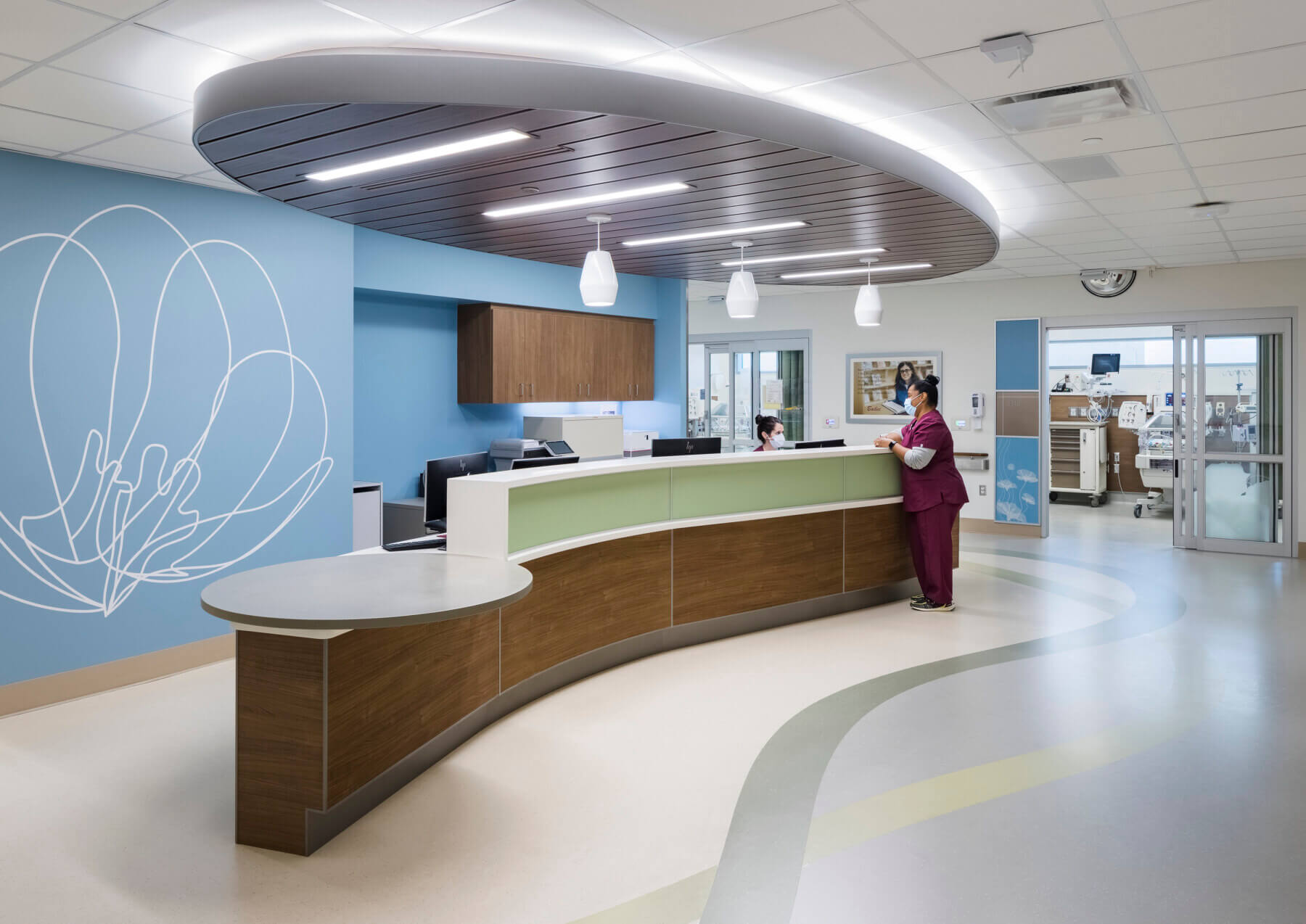 two nurses at a nurse station