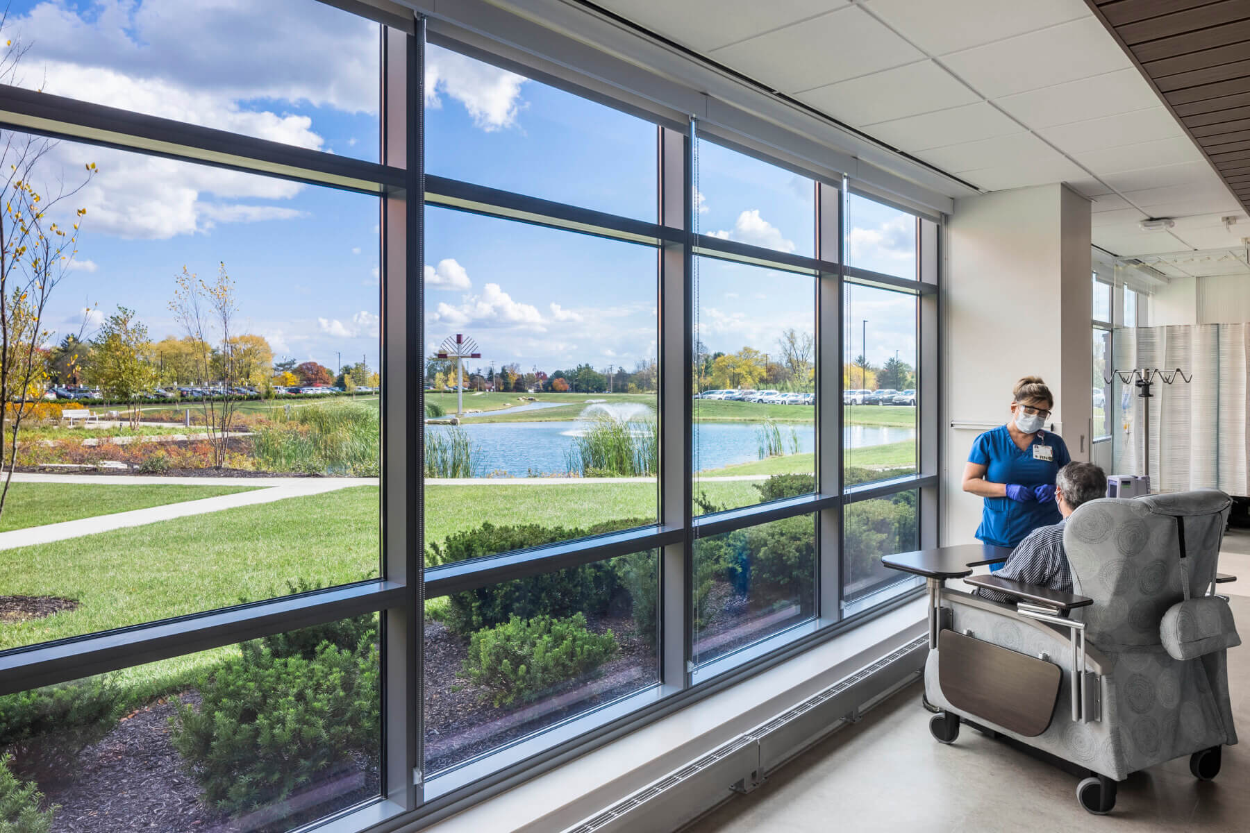 patients and nurse in oncology treatment space