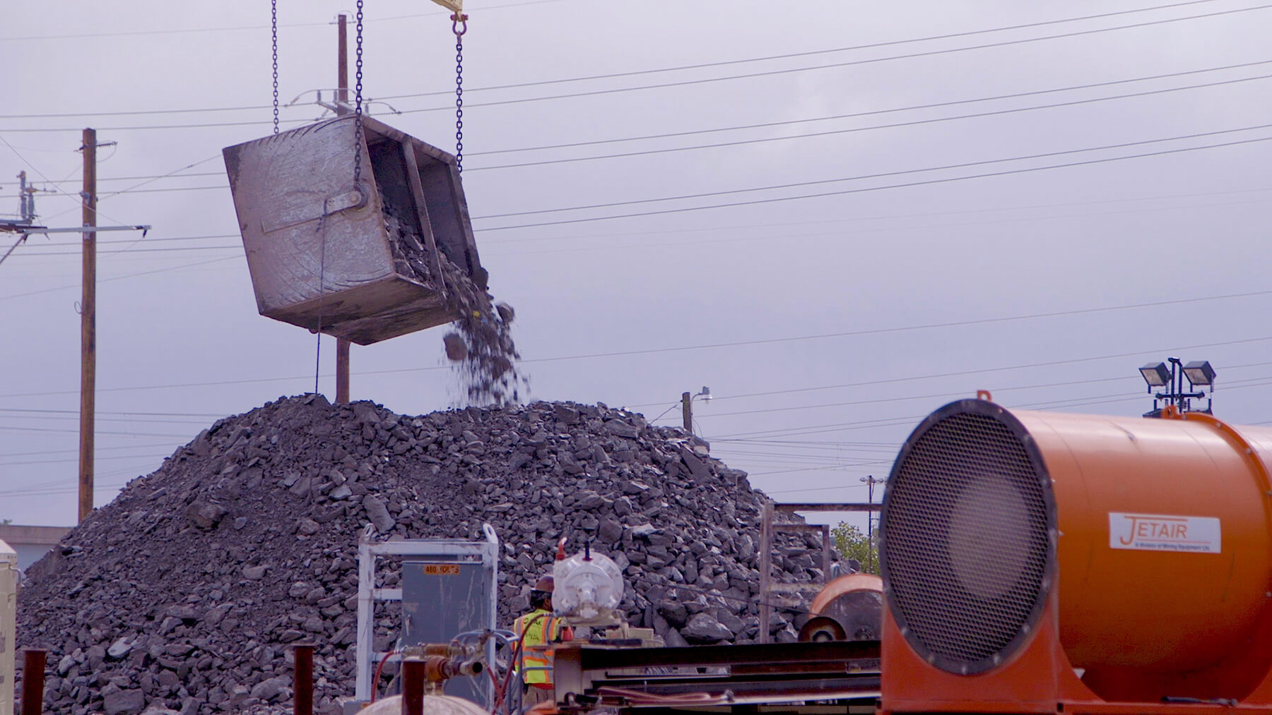 Deer Creek Sanitary Tunnel Pump Station shaft excavation showing a large bucket of rubble.