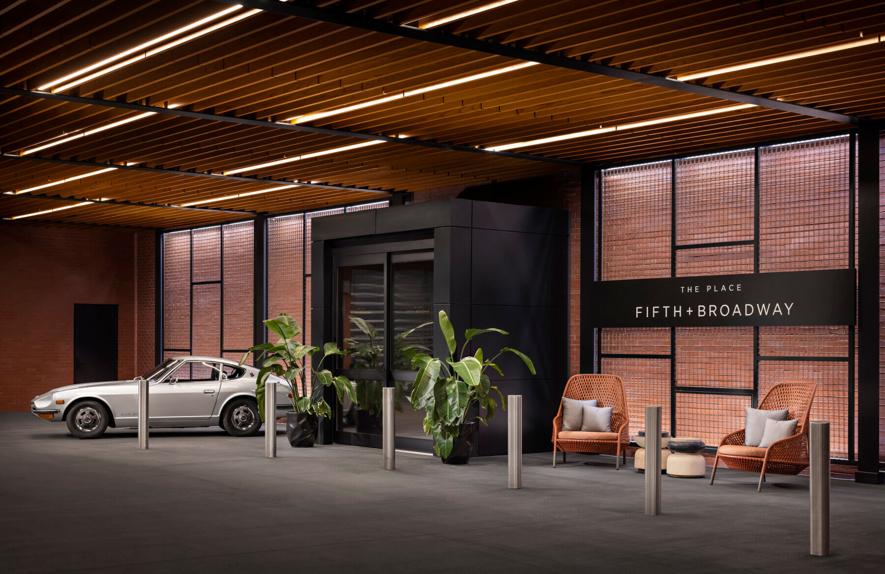 An rendering for the entrance of The Place with a car in front