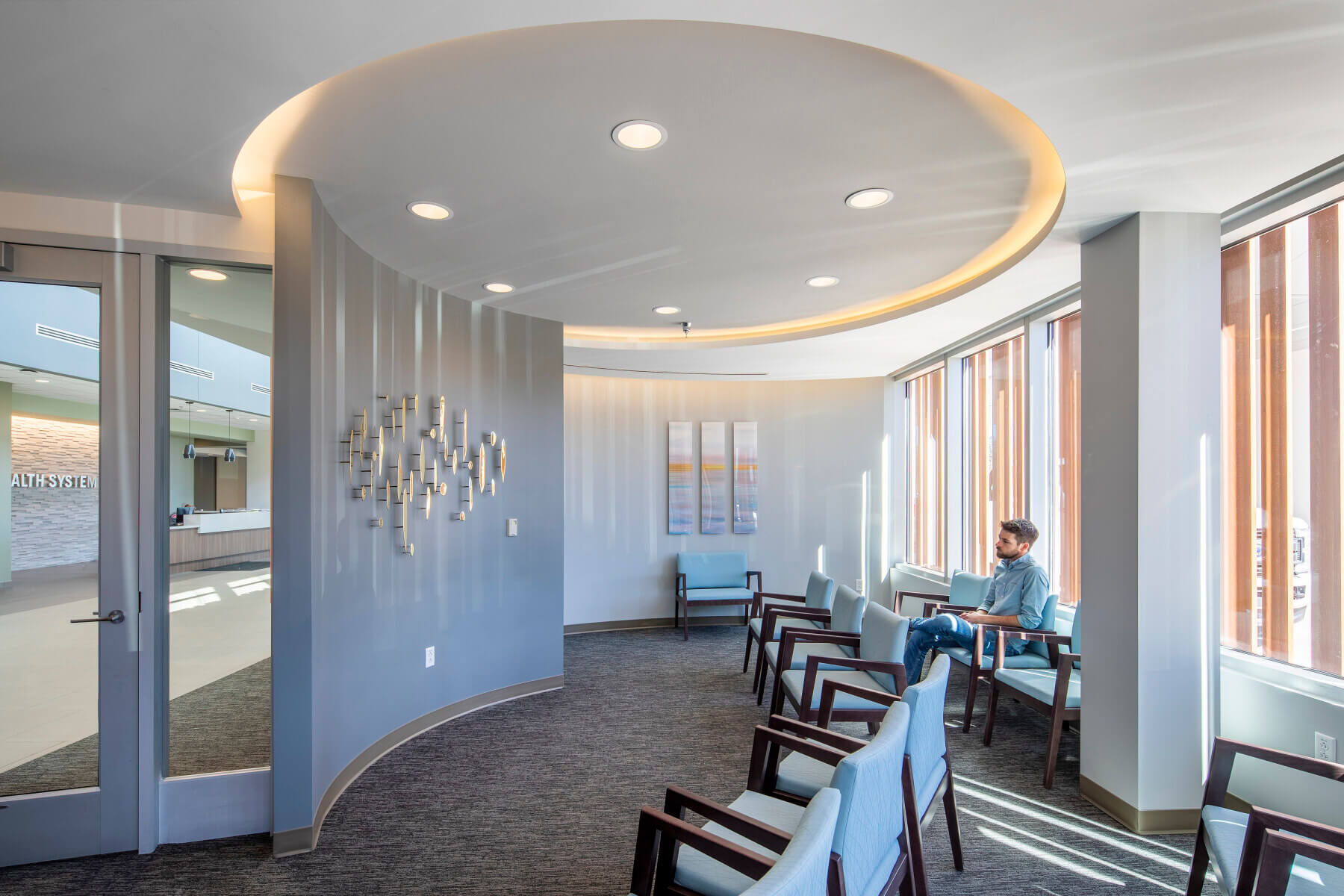waiting room with soothing blue décor and natural artwork