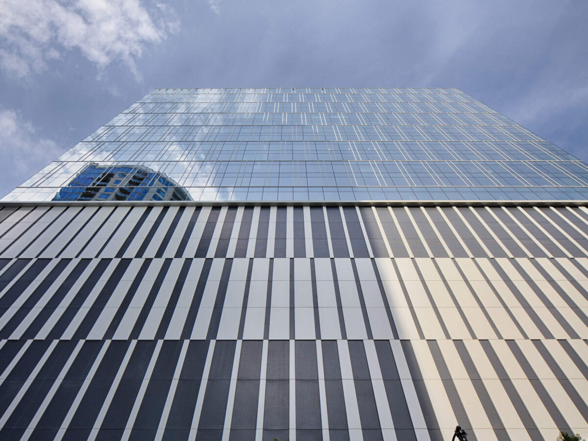 view of office building windows from street level