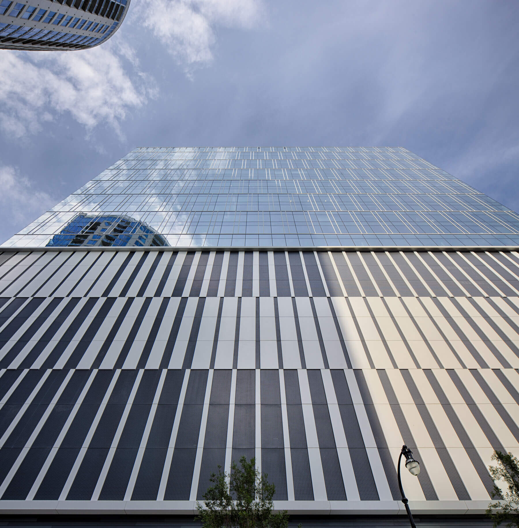 view of office building windows from street level
