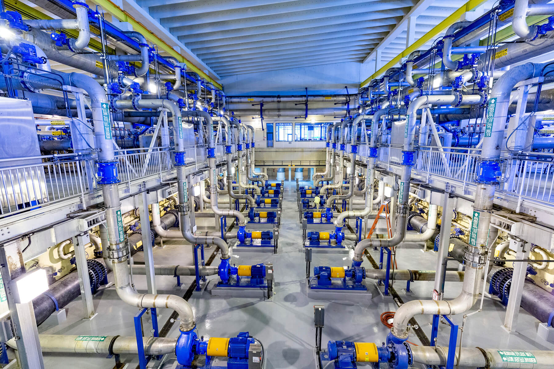 Interior view of F. Wayne Hill Water Resources Center showing an intricate network of pipes and equipment