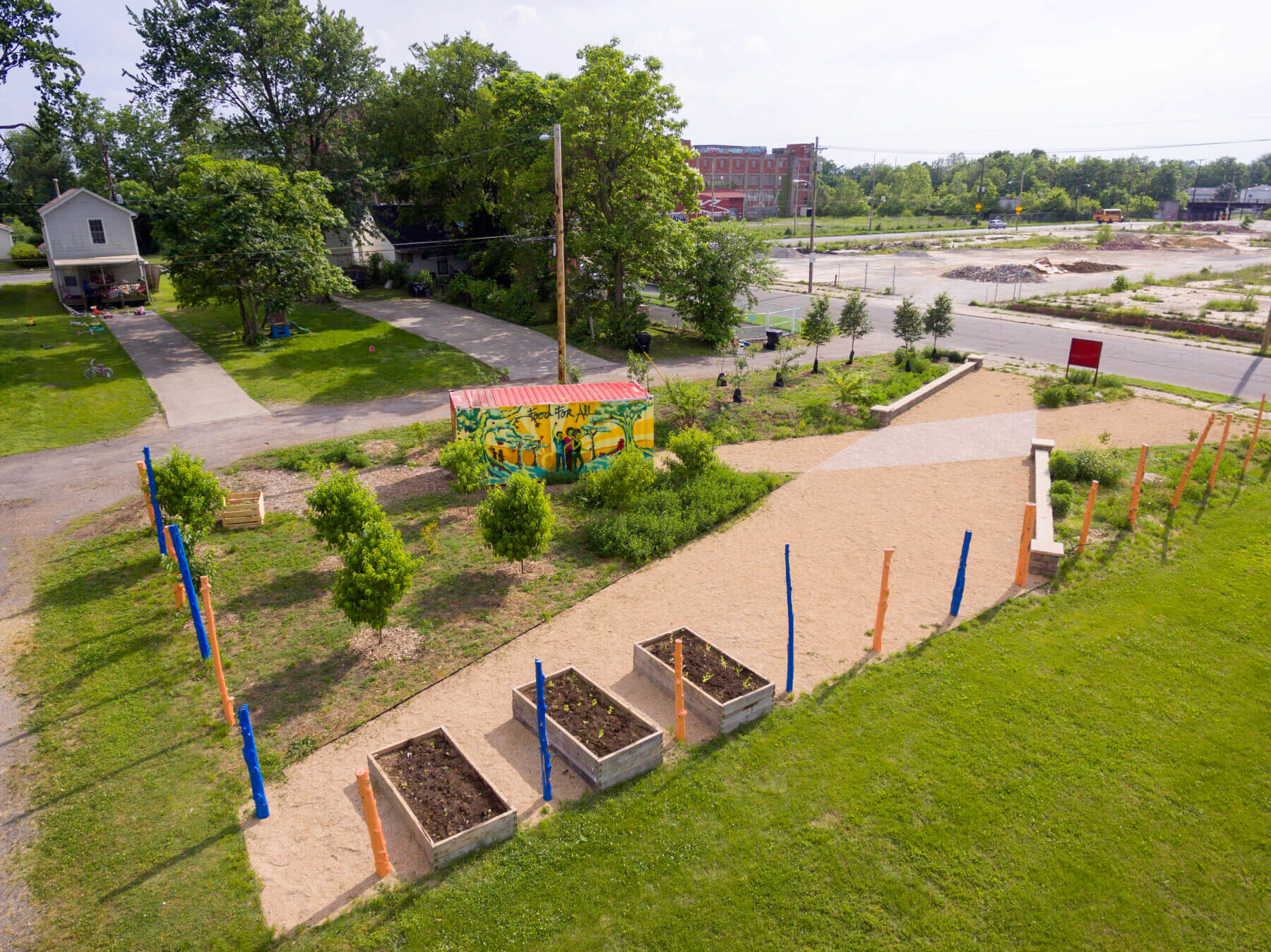 an aerial shot of a community garden