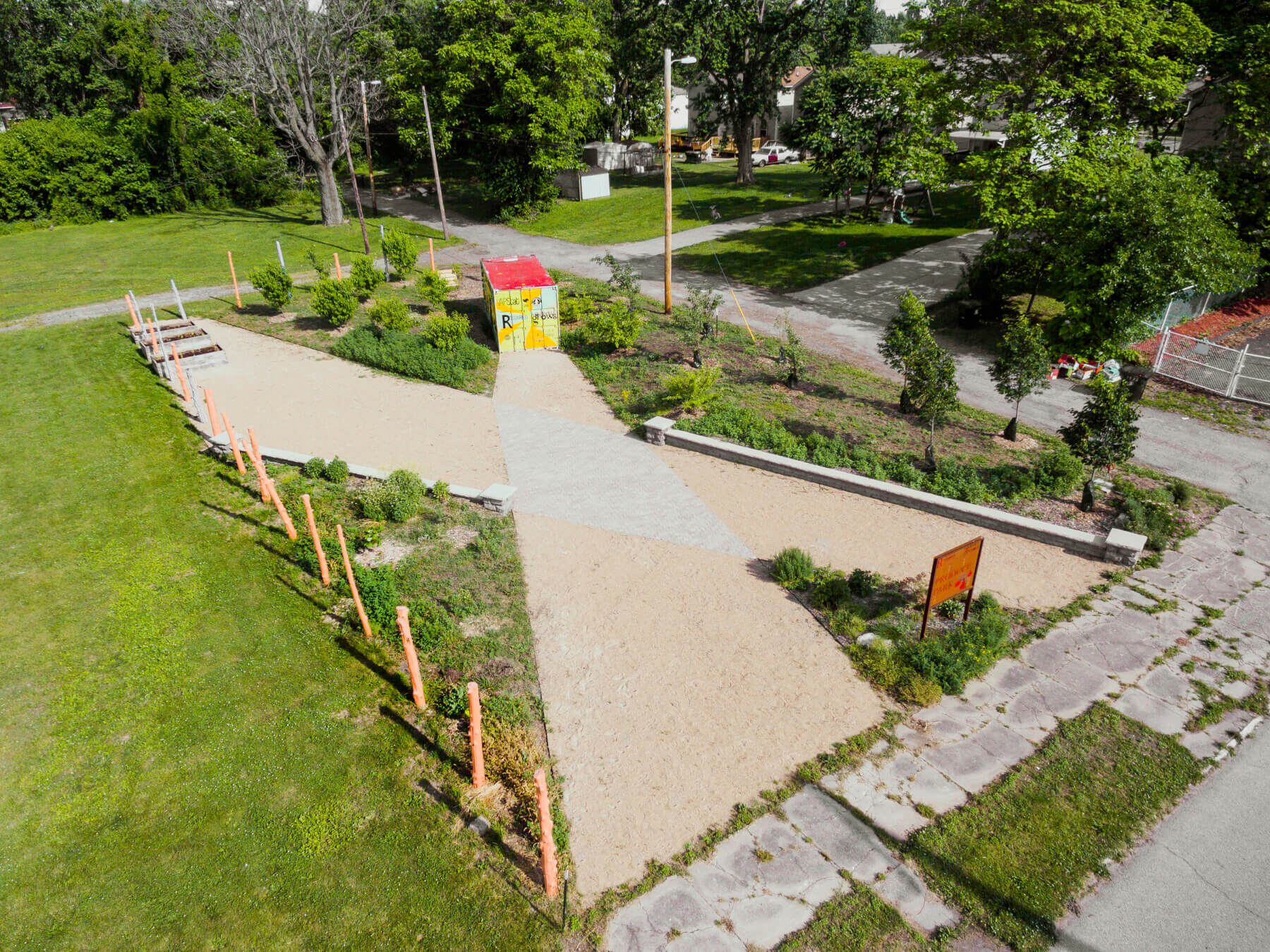 an aerial shot of a community garden