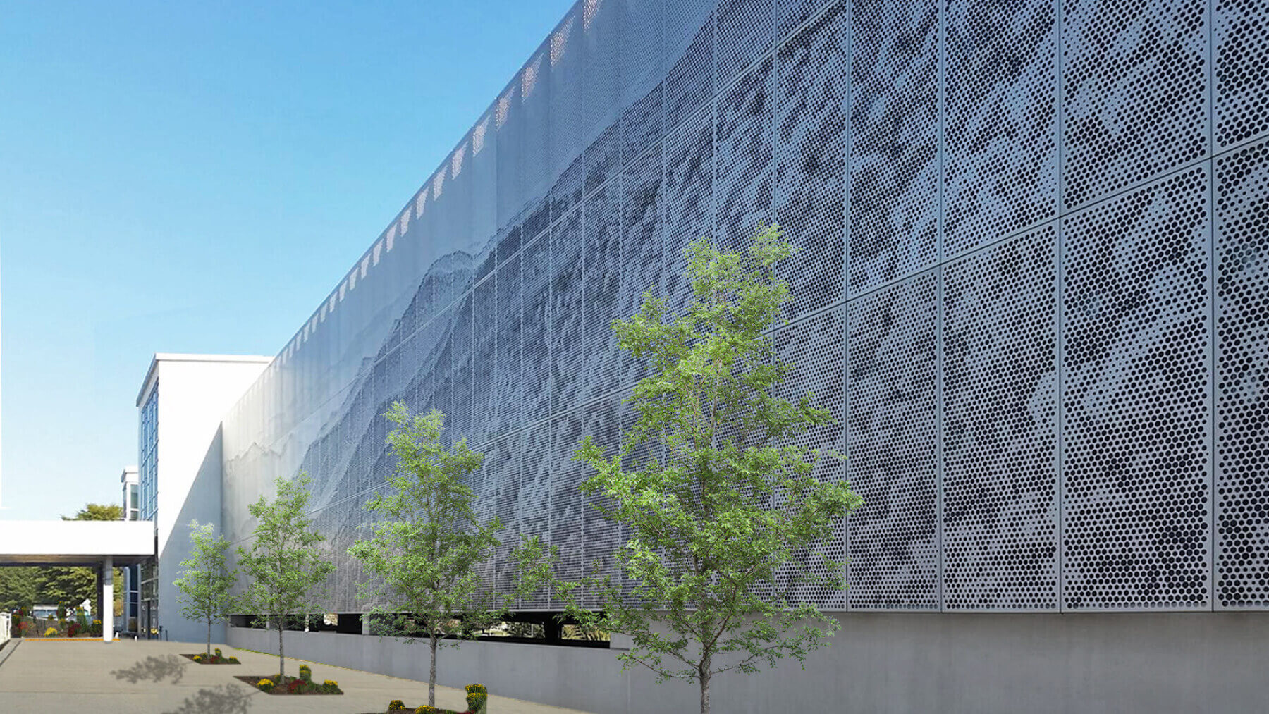 the perforated metal screen on the outside of Asheville Regional Airport’s three-story parking garage