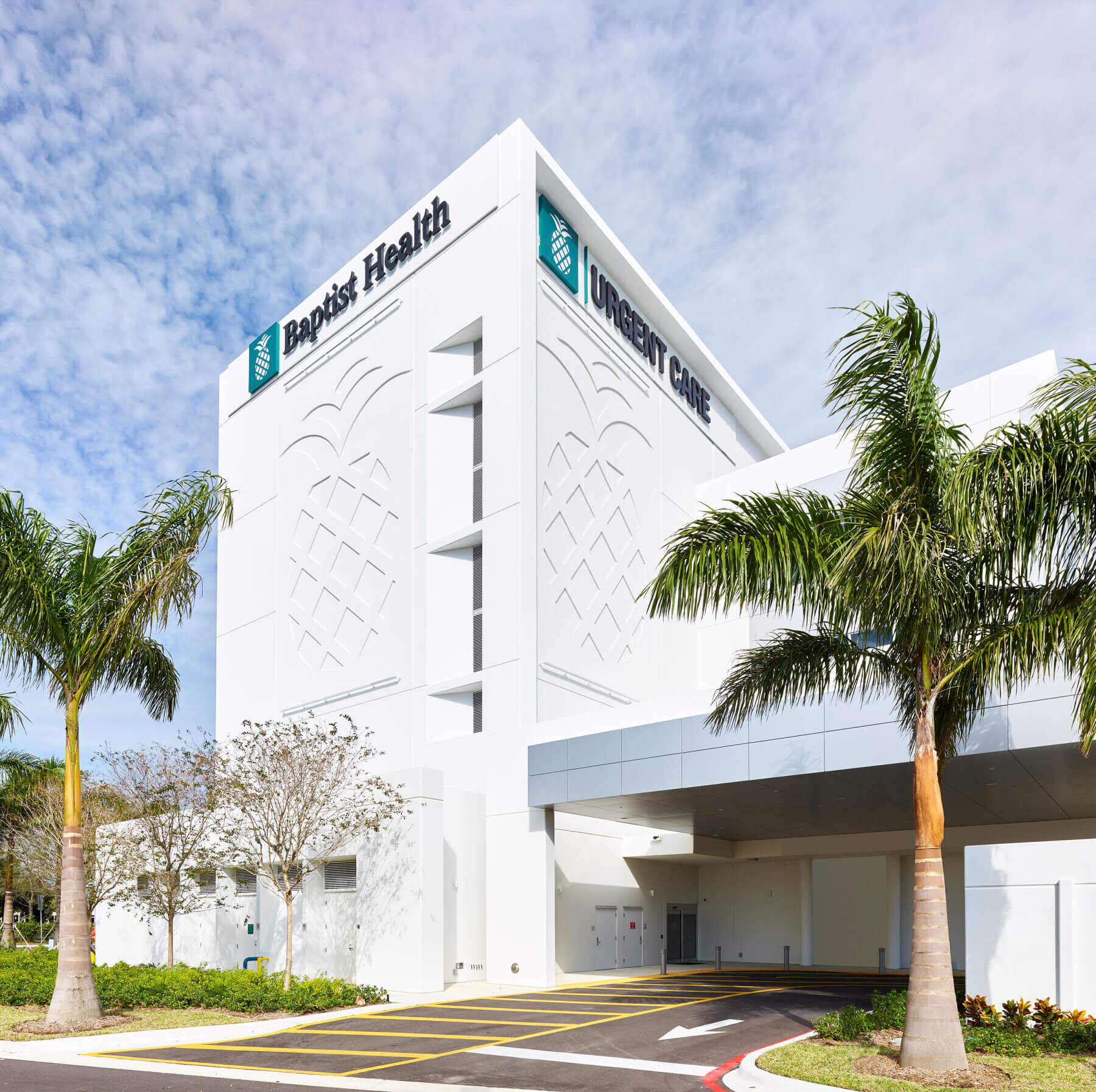 health system logo embossed in concrete on side of building