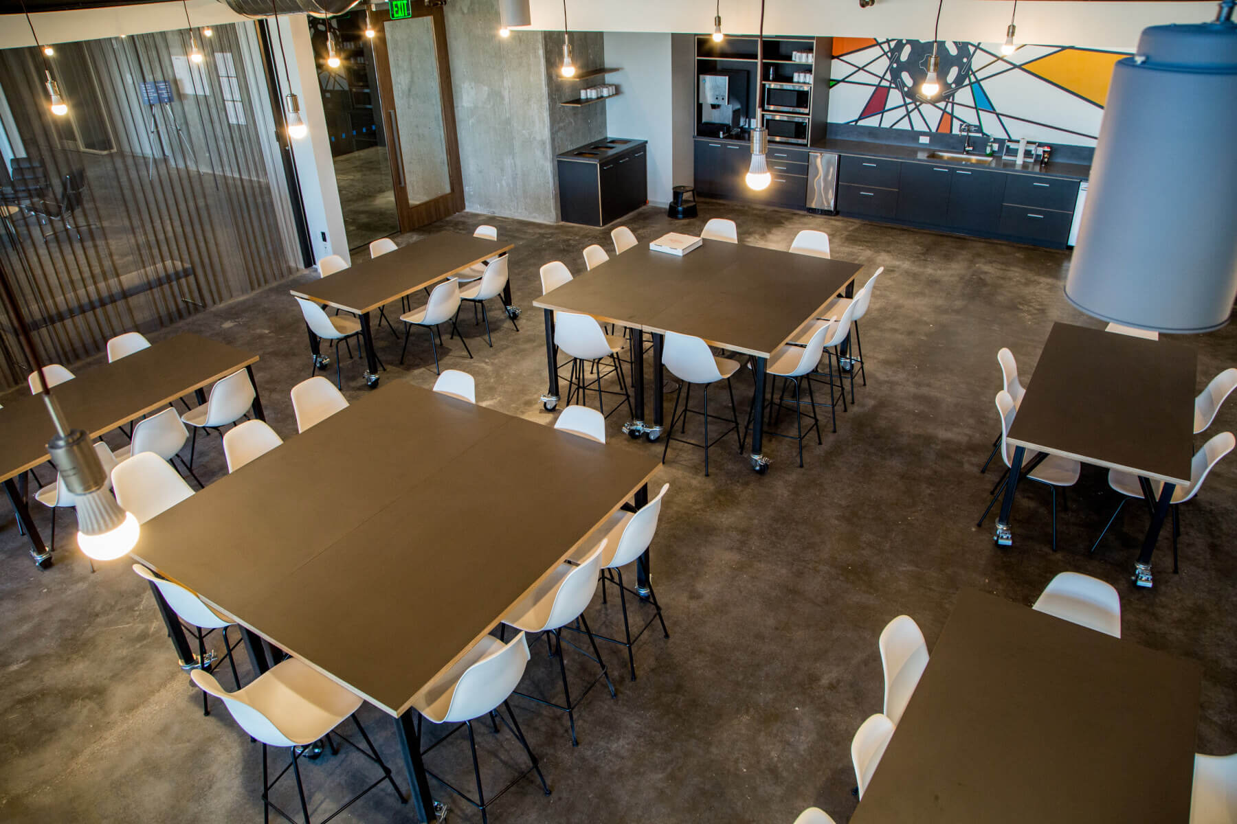 overhead view of tables, seating, and kitchen in the main hub