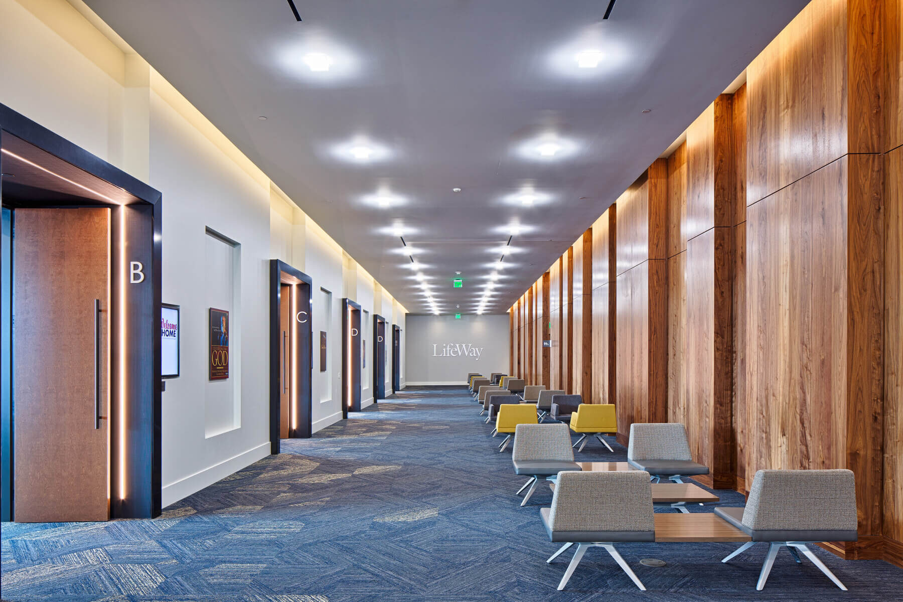 Chairs in a hallway and walls lined with wood in the LifeWay Christian