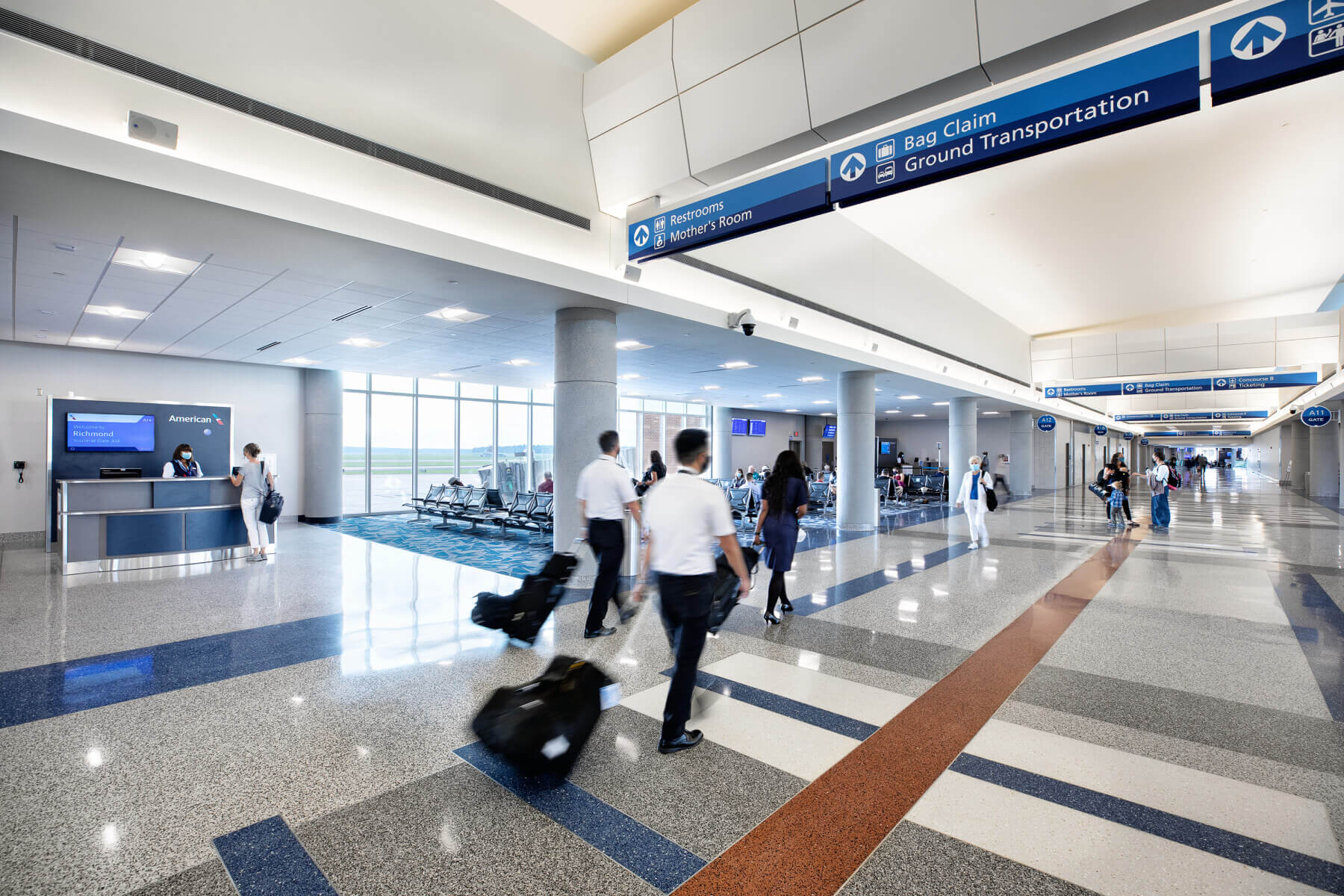 passengers walking down the concourse in terminal A at Richmond International Airport