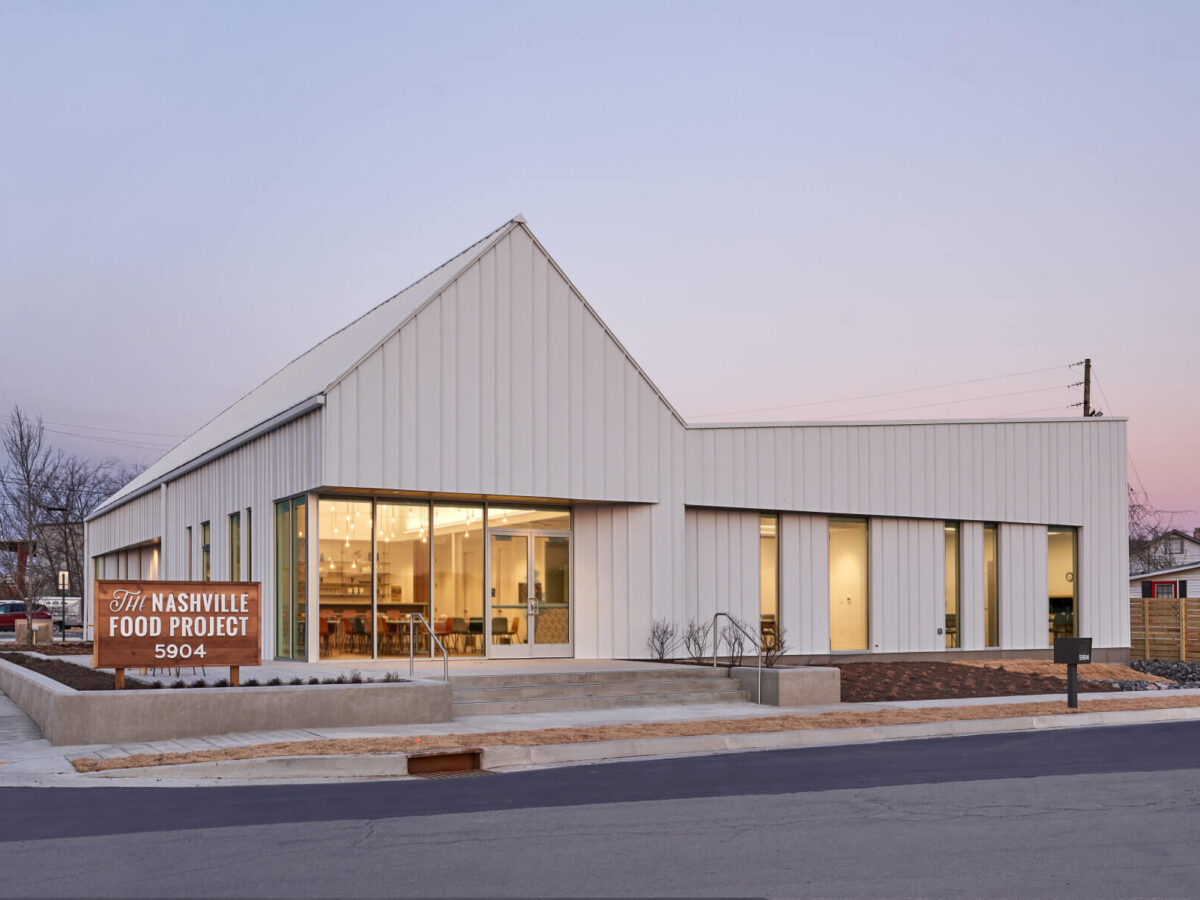 The exterior of the Nashville Food Project with a man walking in front of it