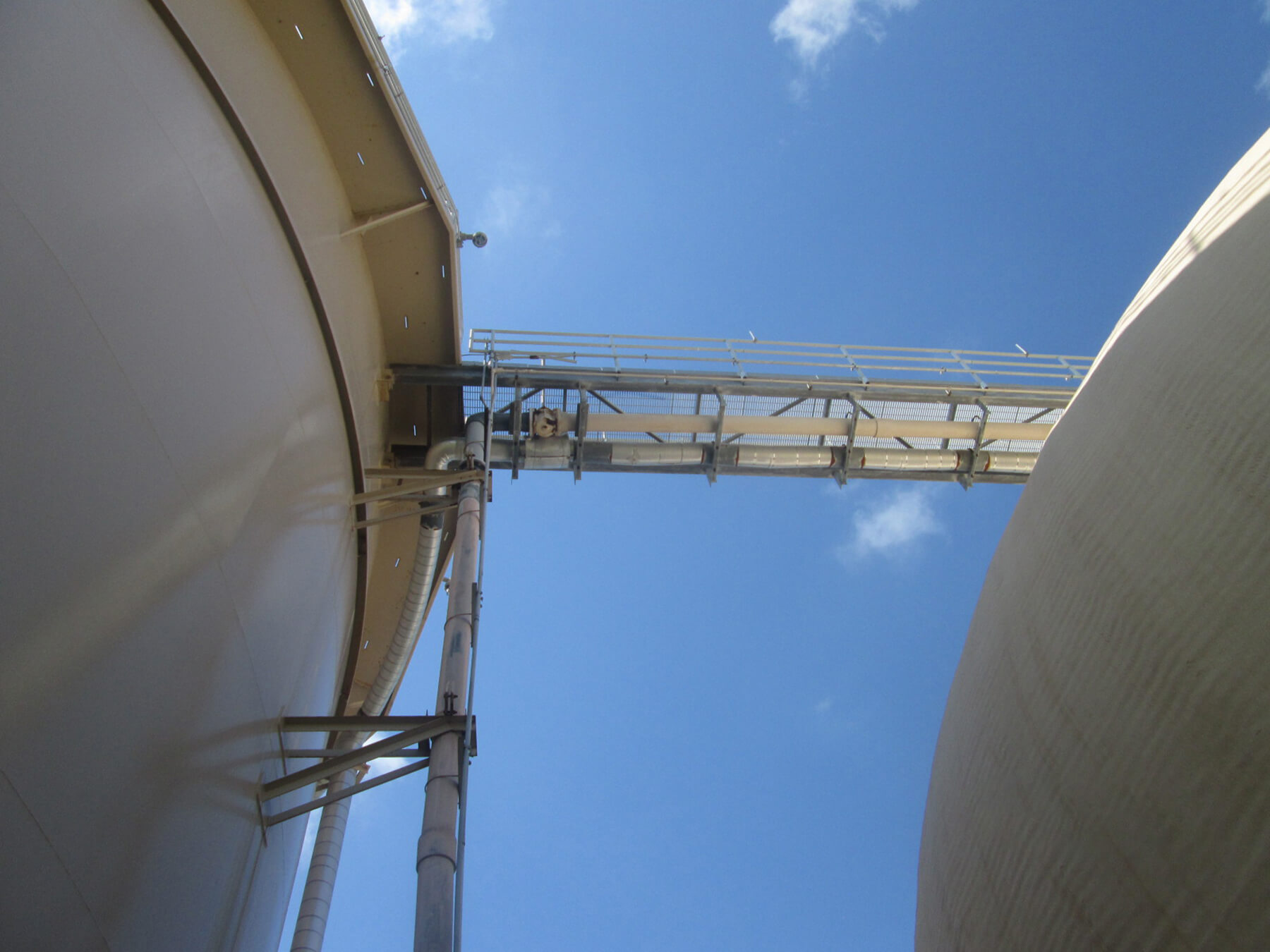 Two tall tanks with a connecting walkway at South Cross Bayou WRF.