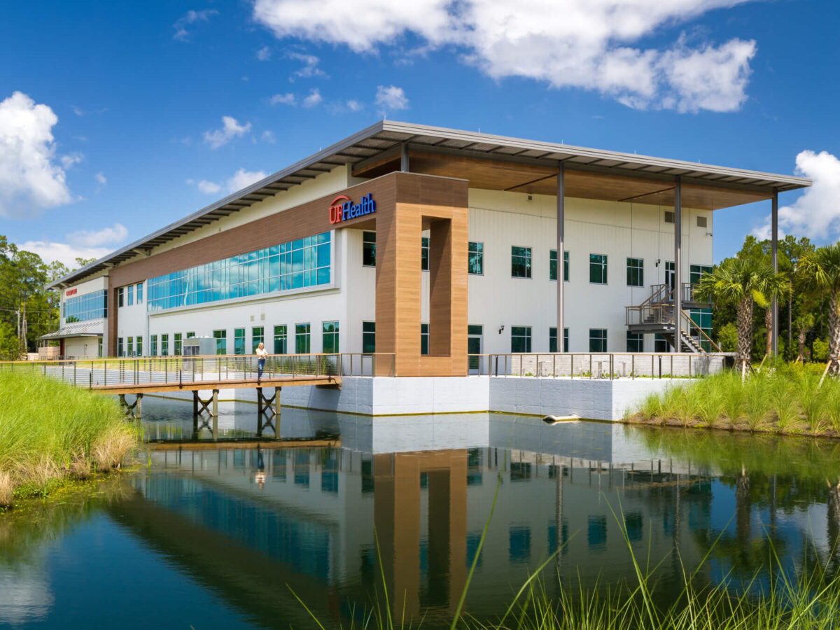 building exterior with water and bridge