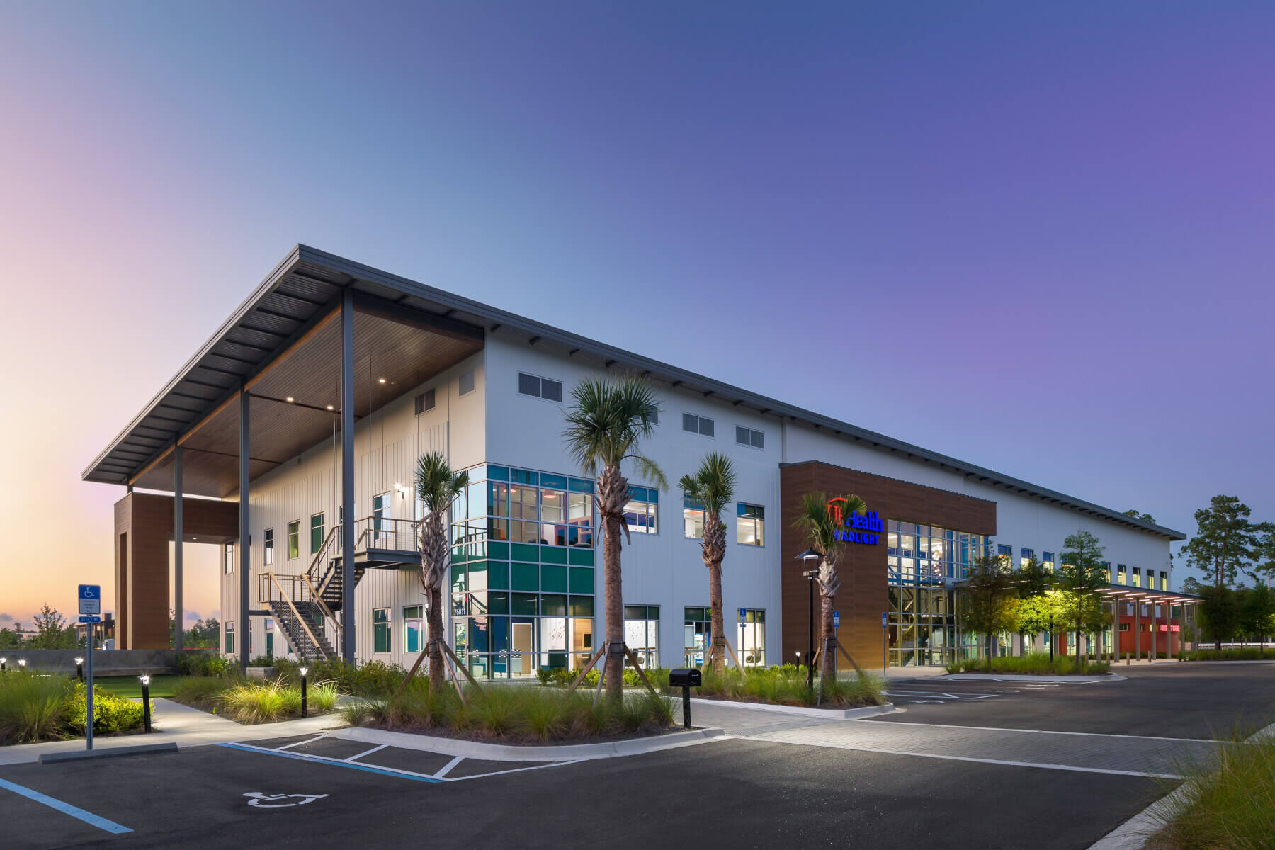 building exterior with purple sunset