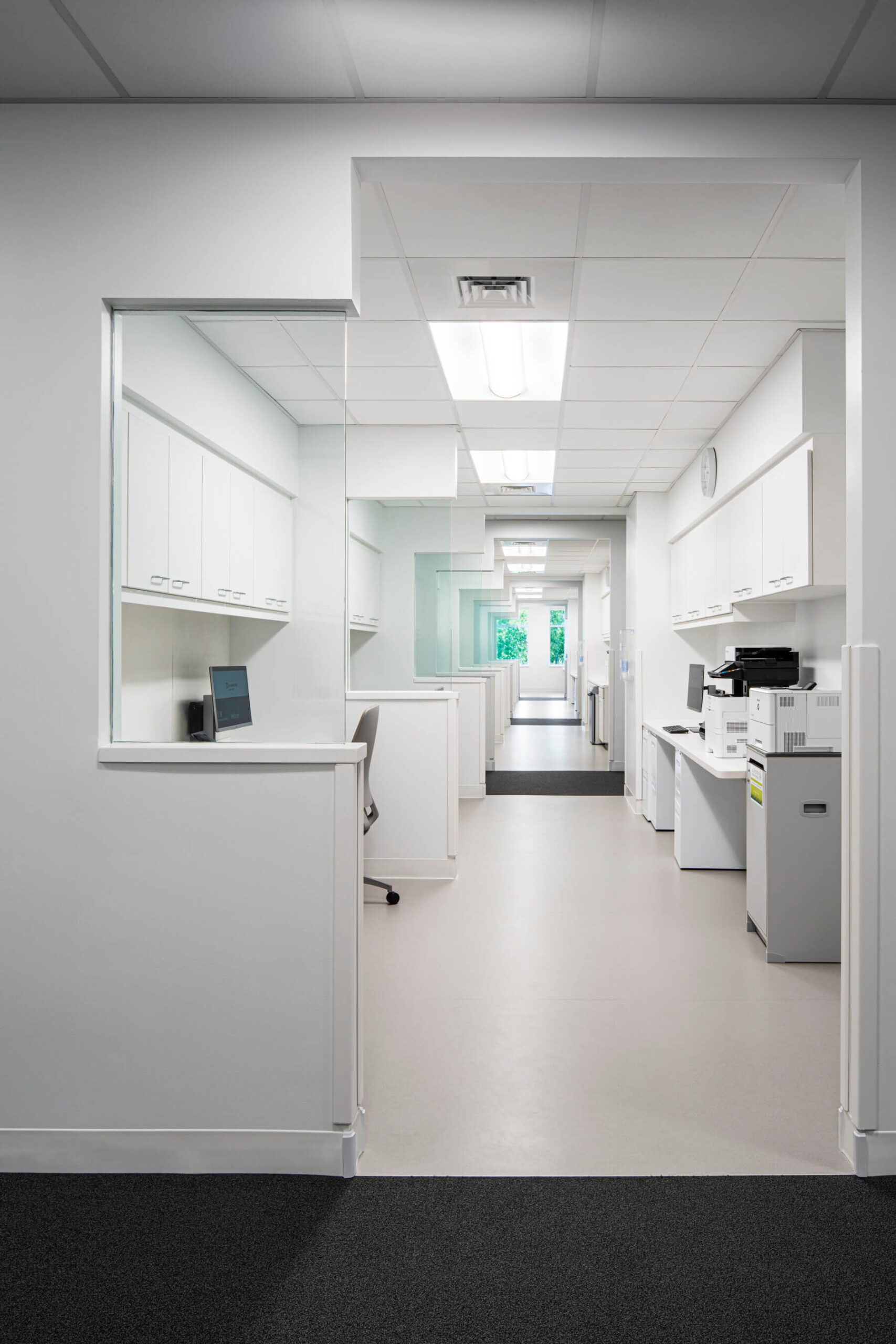 space with a desk and printer for charting and administrative tasks