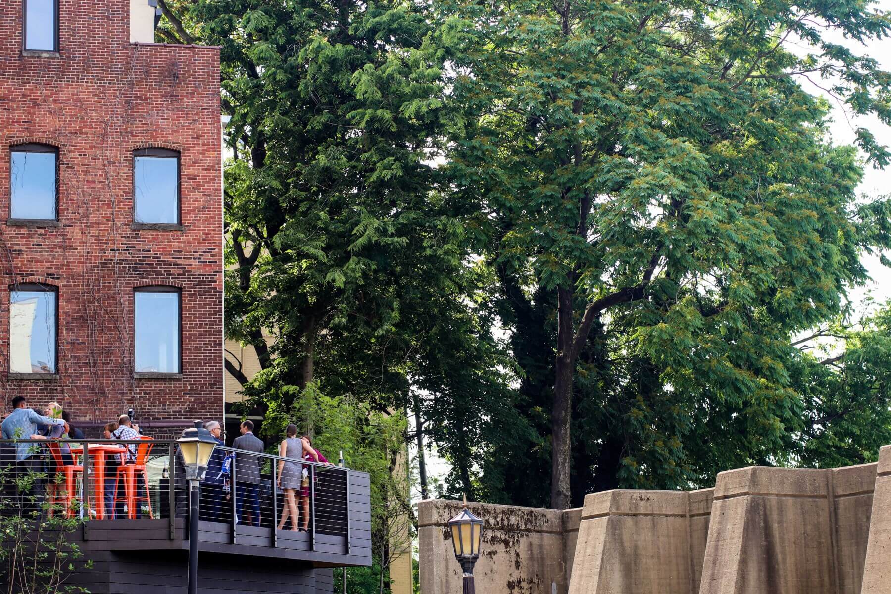 people on the deck at the Leadership Louisville Center Courtyard