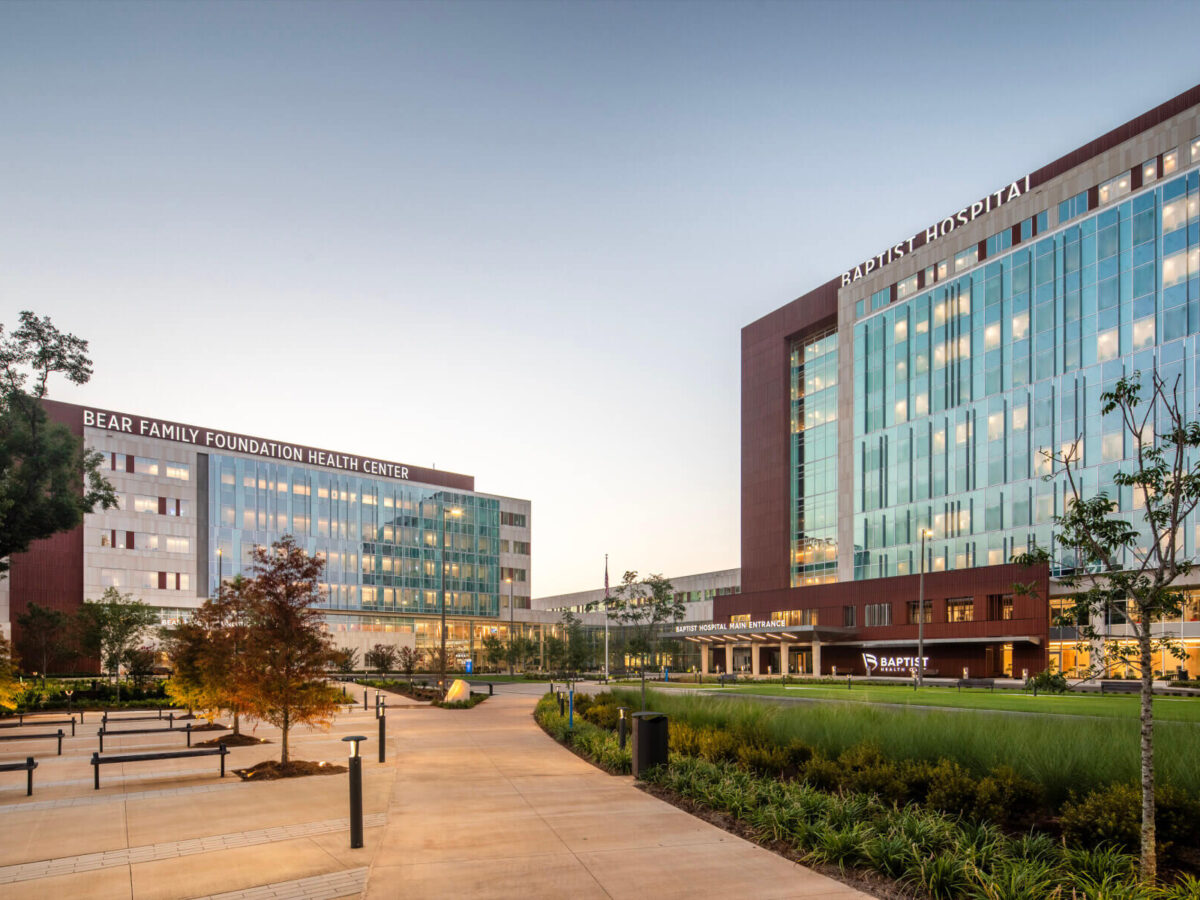 the exterior of a hospital and medical office building at dusk