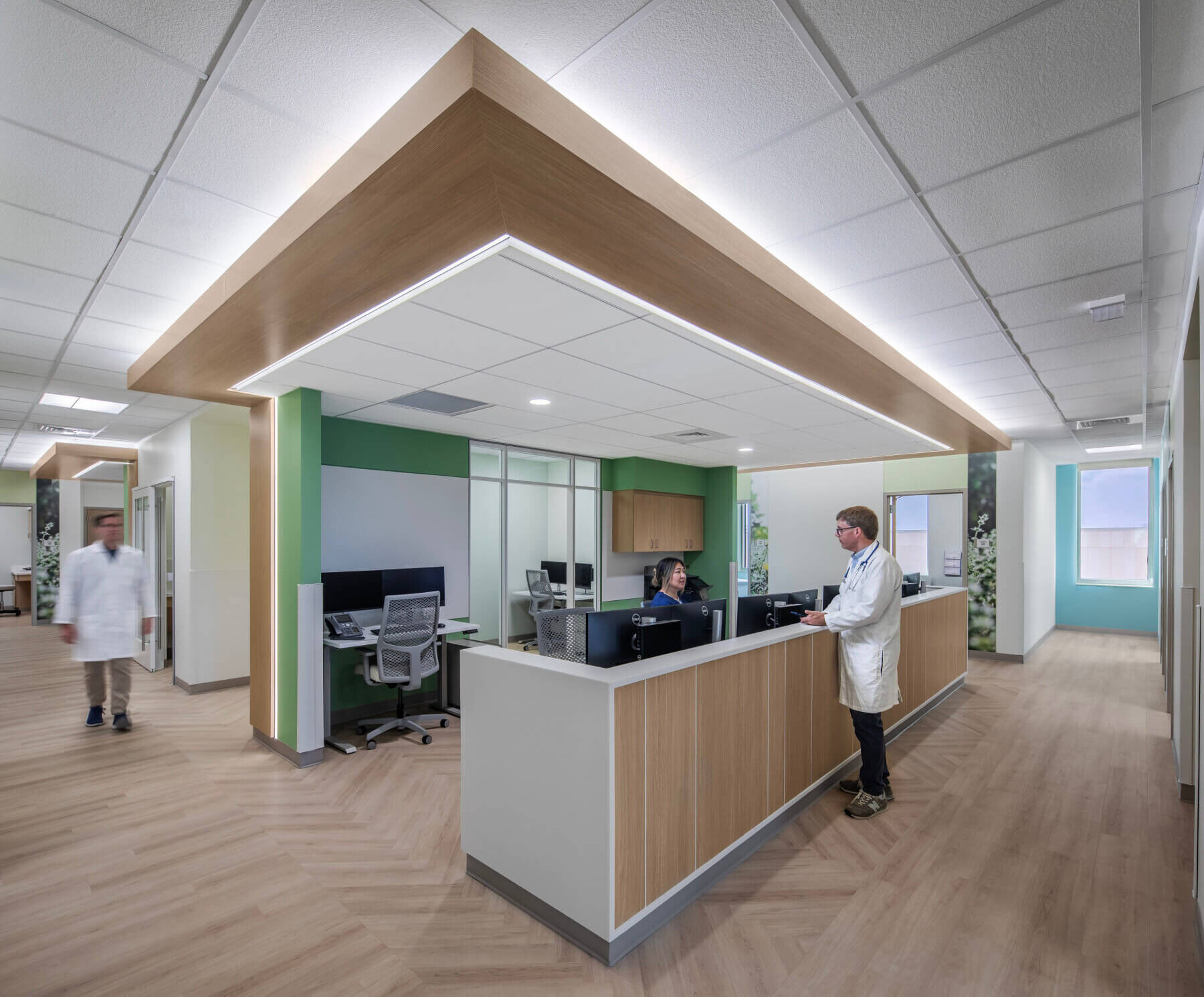 a nurse and doctor at a nurse station