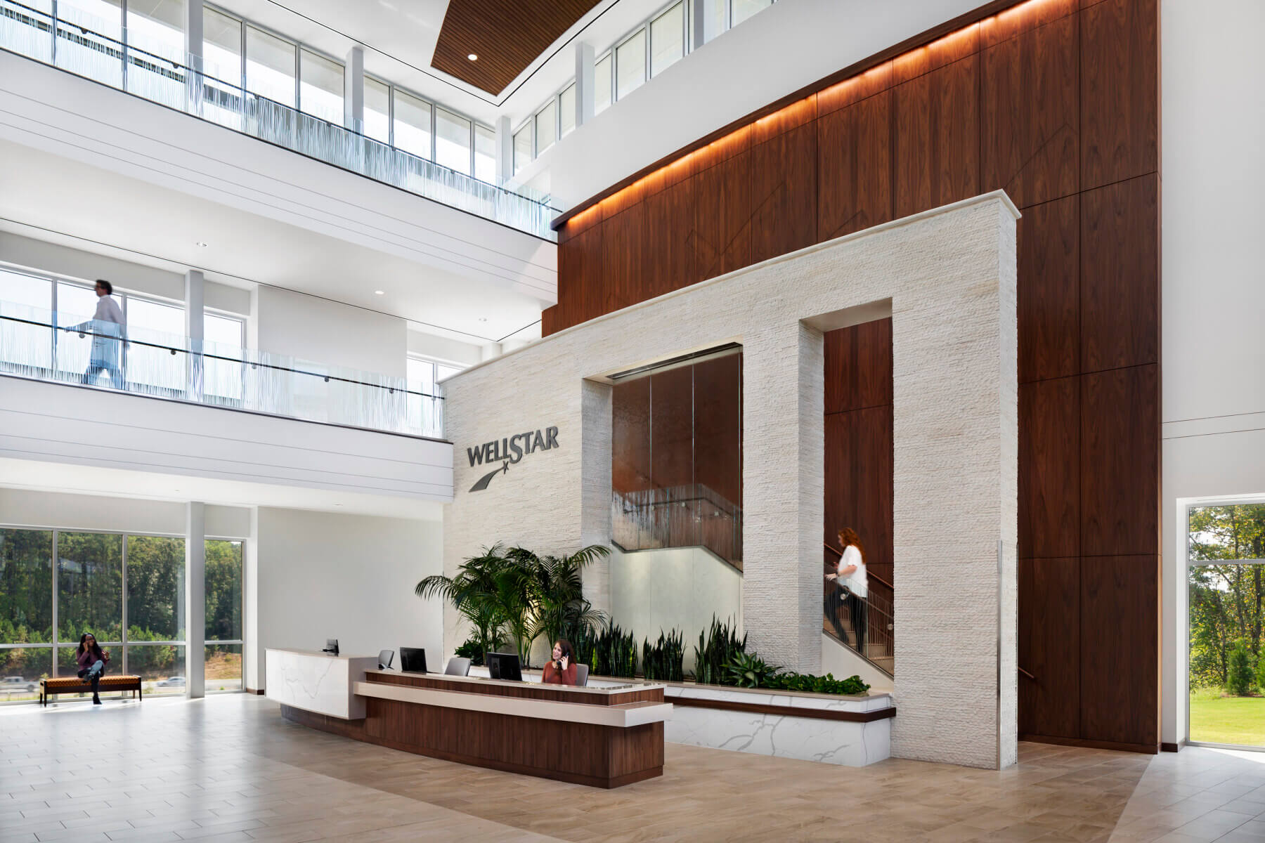 main lobby with reception desk and staircase