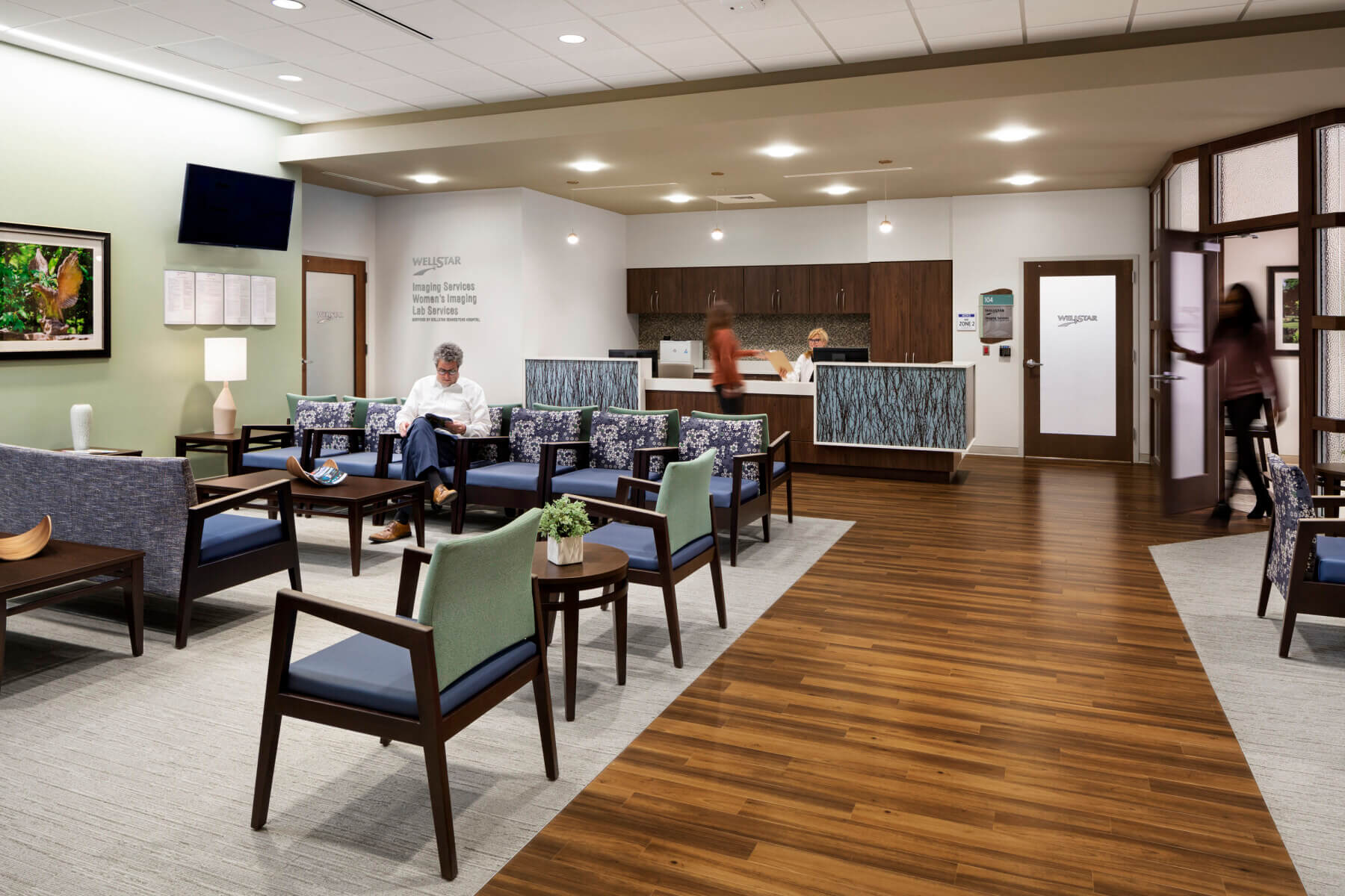 patient is called to the reception desk at the women’s imaging center