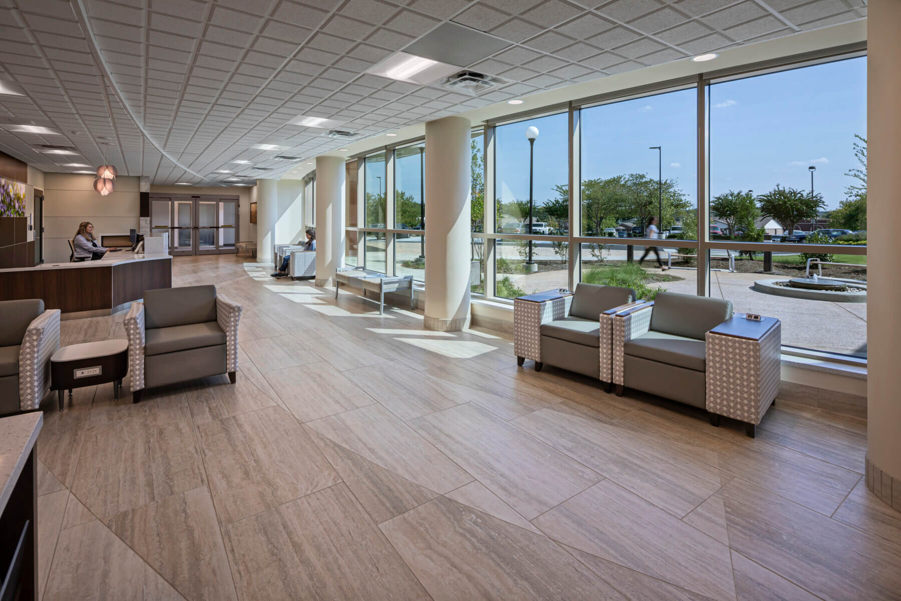 a lobby with windows looking into the garden