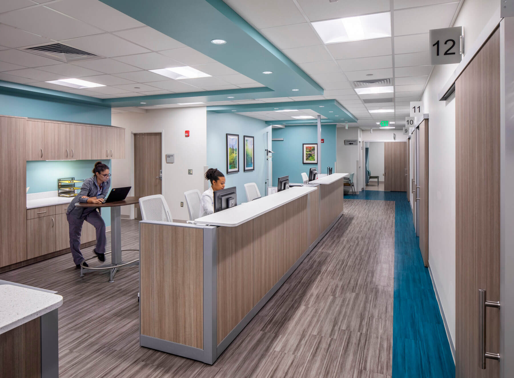 nurses working at a nurse station in a pediatrician’s office