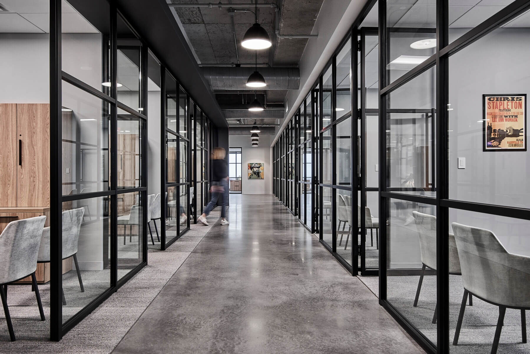 A hallway of individual offices with windows in the Universal Music Group Nashville offices