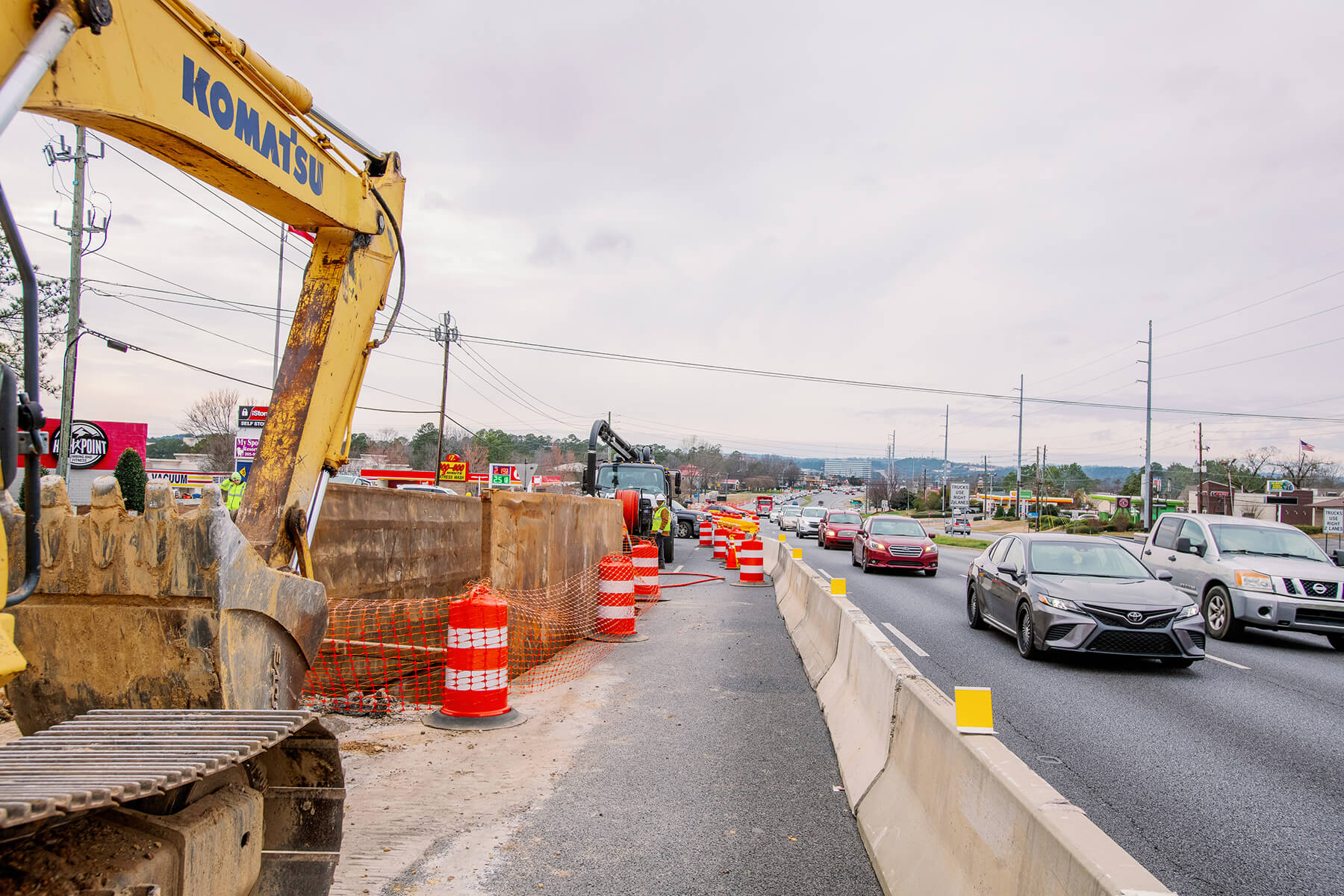 Repair site with bulldozer and cars on Highway 280.