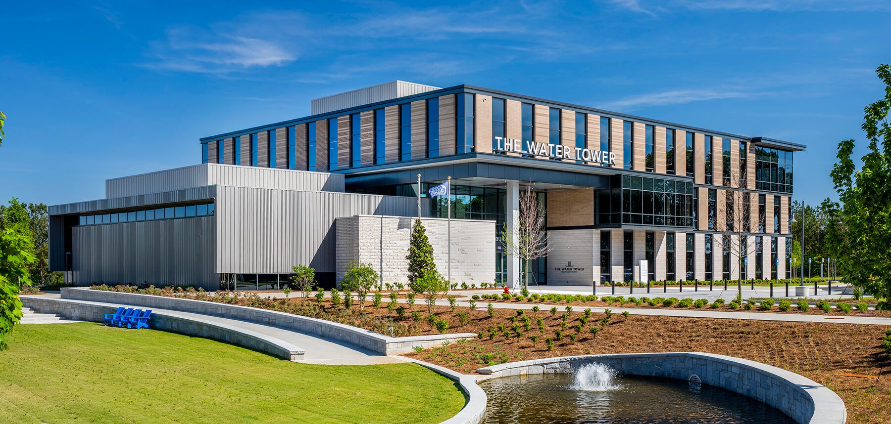 Exterior view of The Water Tower Global Innovation Hub featuring entrance signage