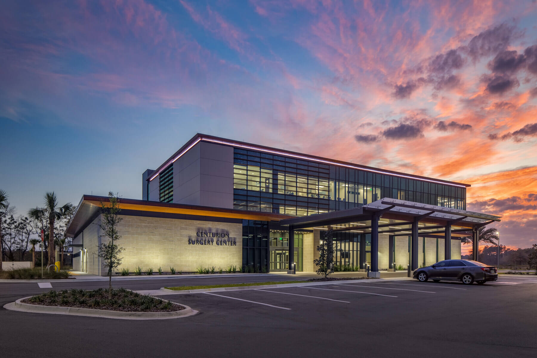 building exterior at night with sunset in background