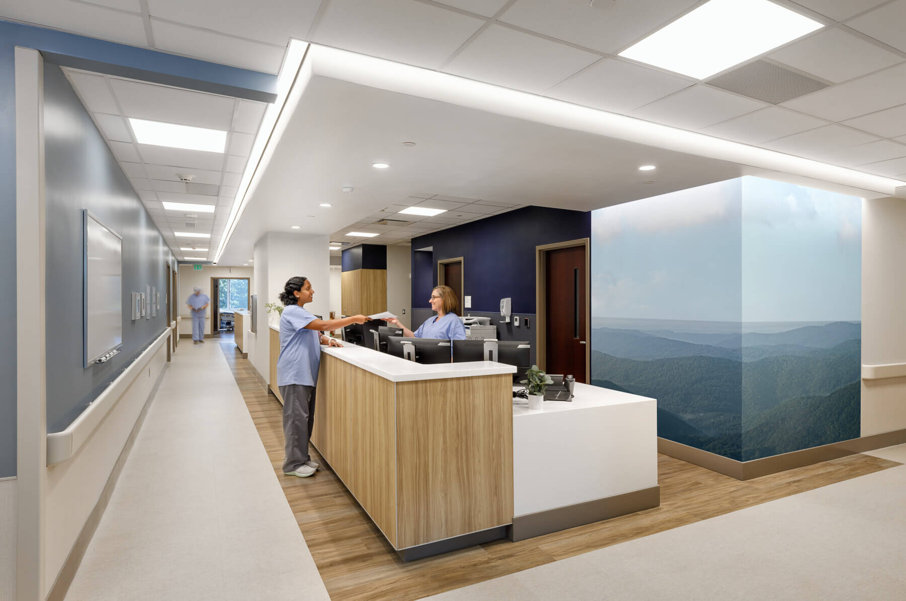 nurses talking at a nurse station