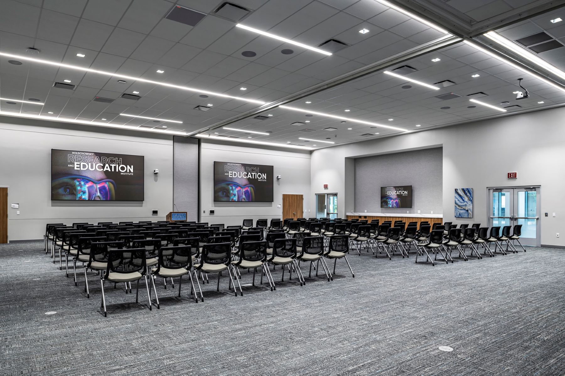 a large auditorium with rows of chairs