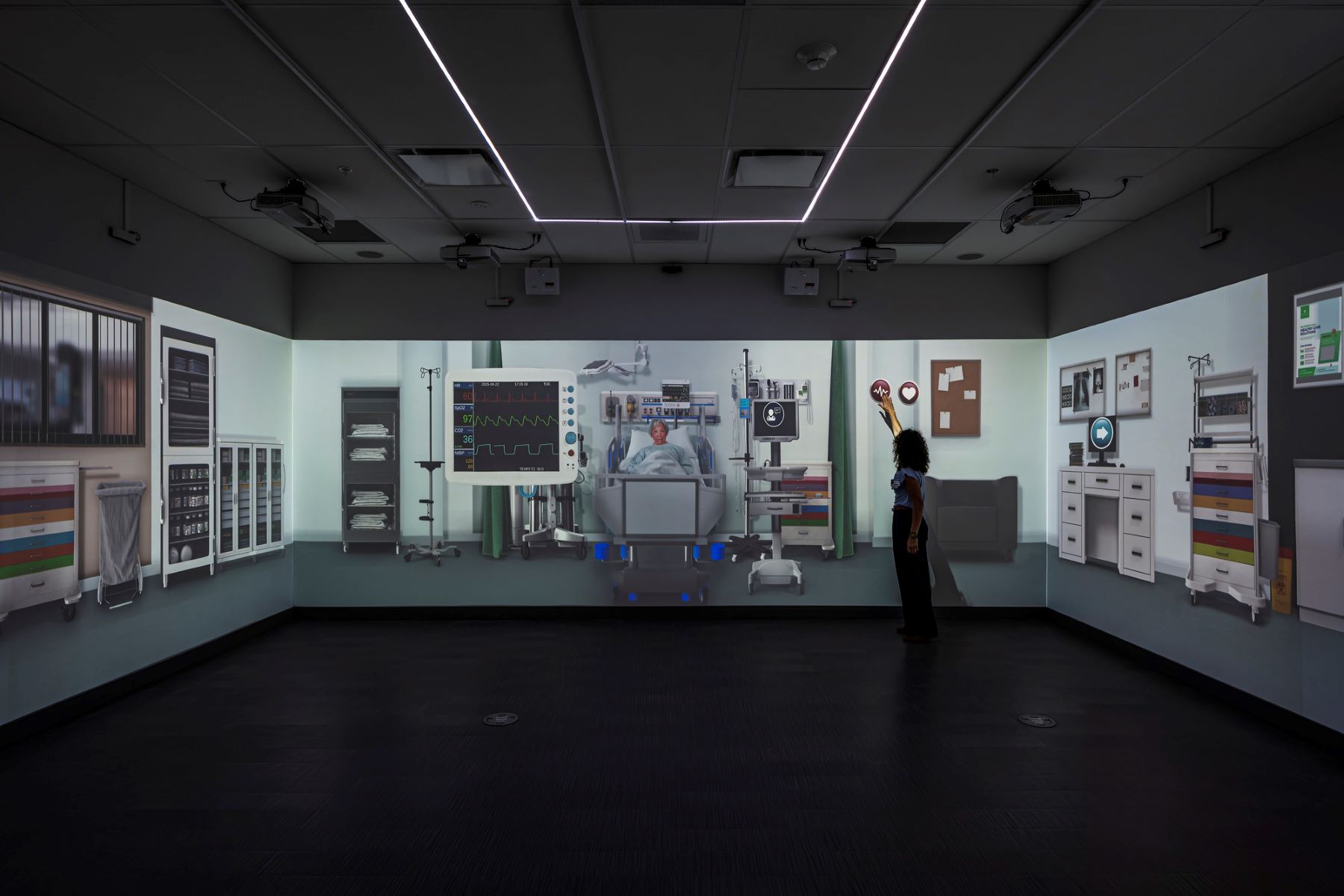a digital medical simulation projected onto a blank wall