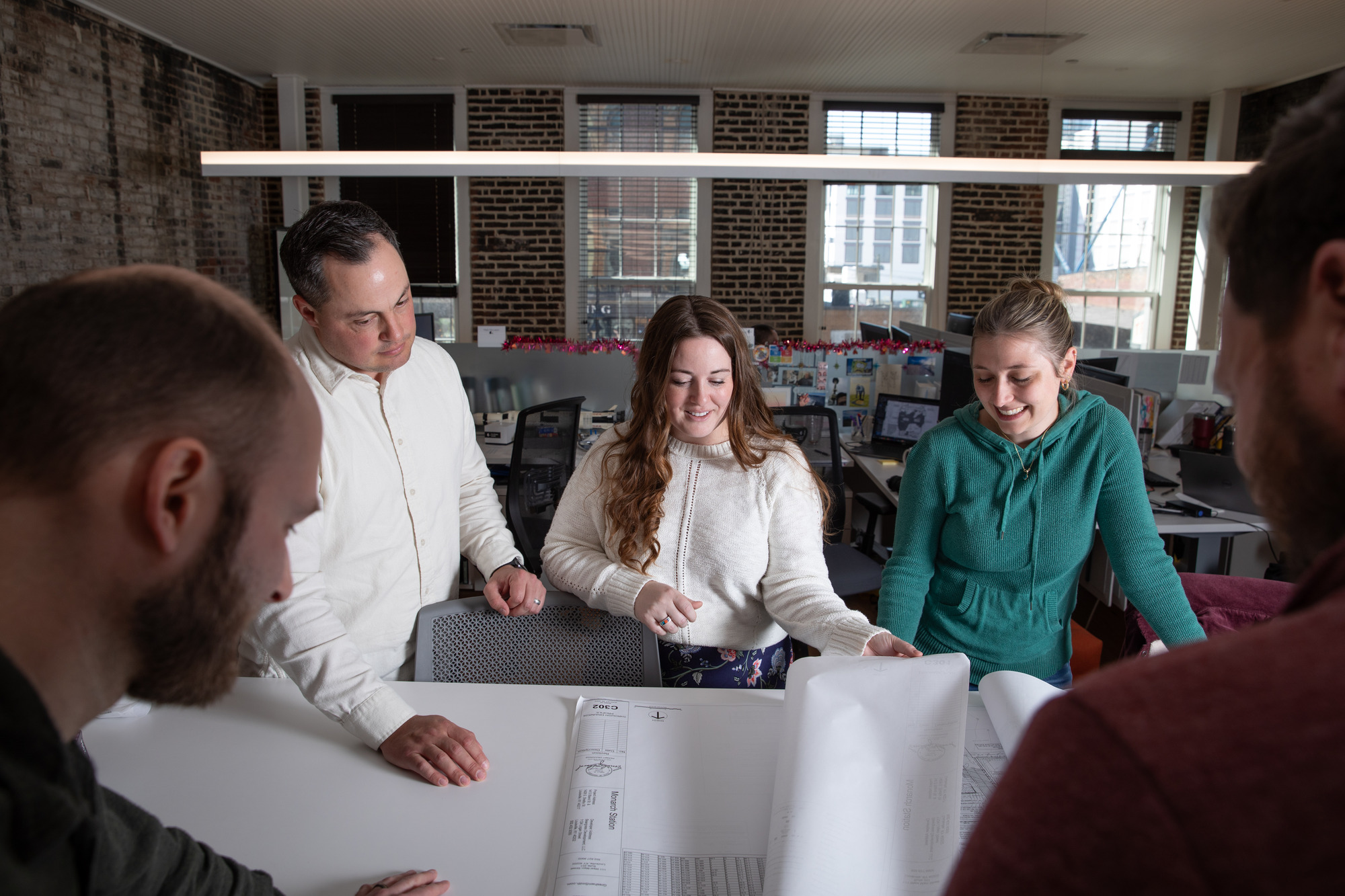 Members of Gresham Smith's Louisville office reviewing plans.